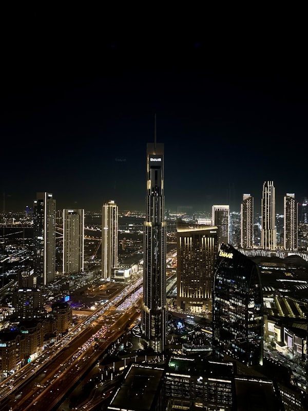 night skyline with a highway of light trails