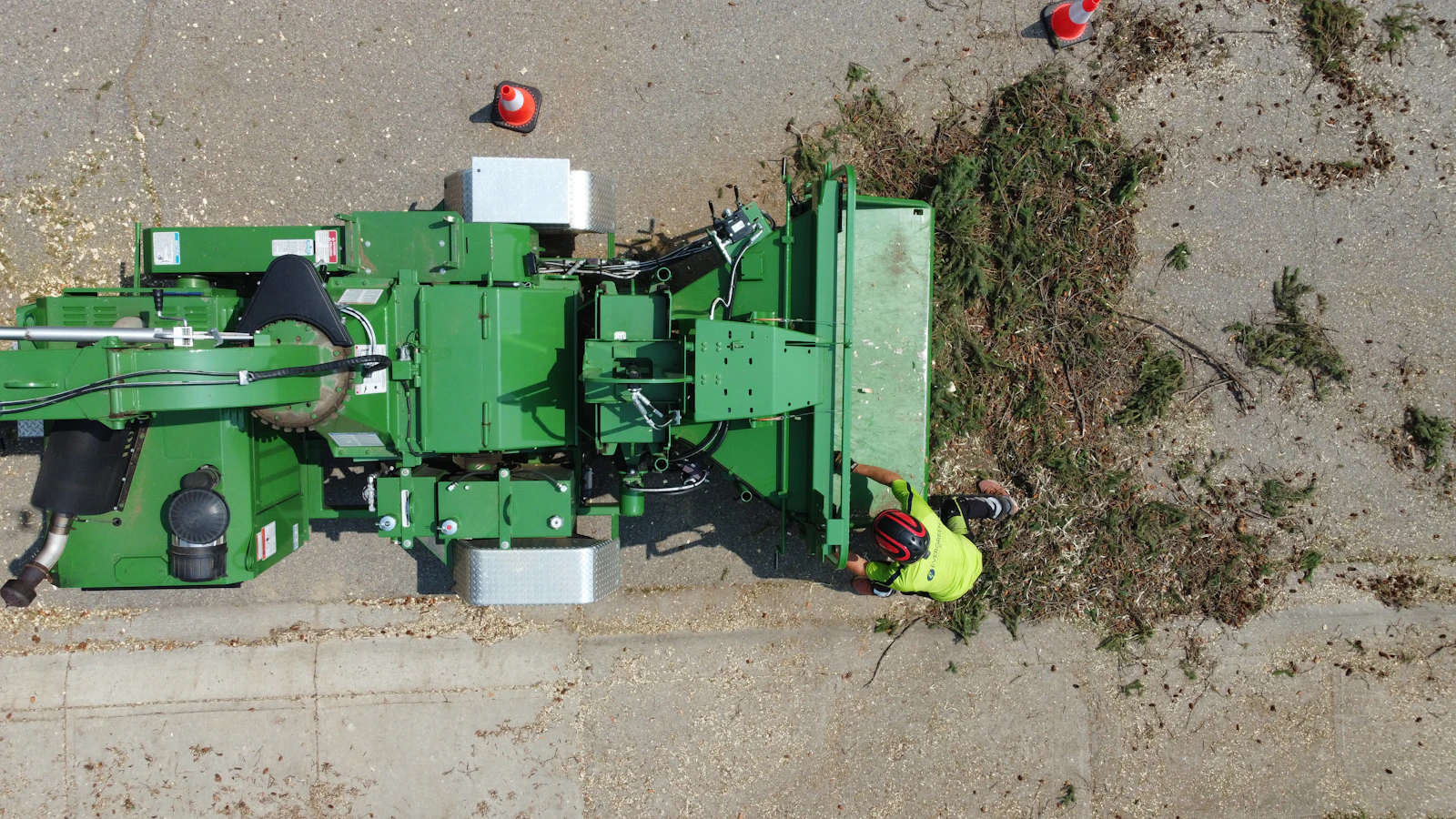 A self-propelled grinder working over ground material on a site