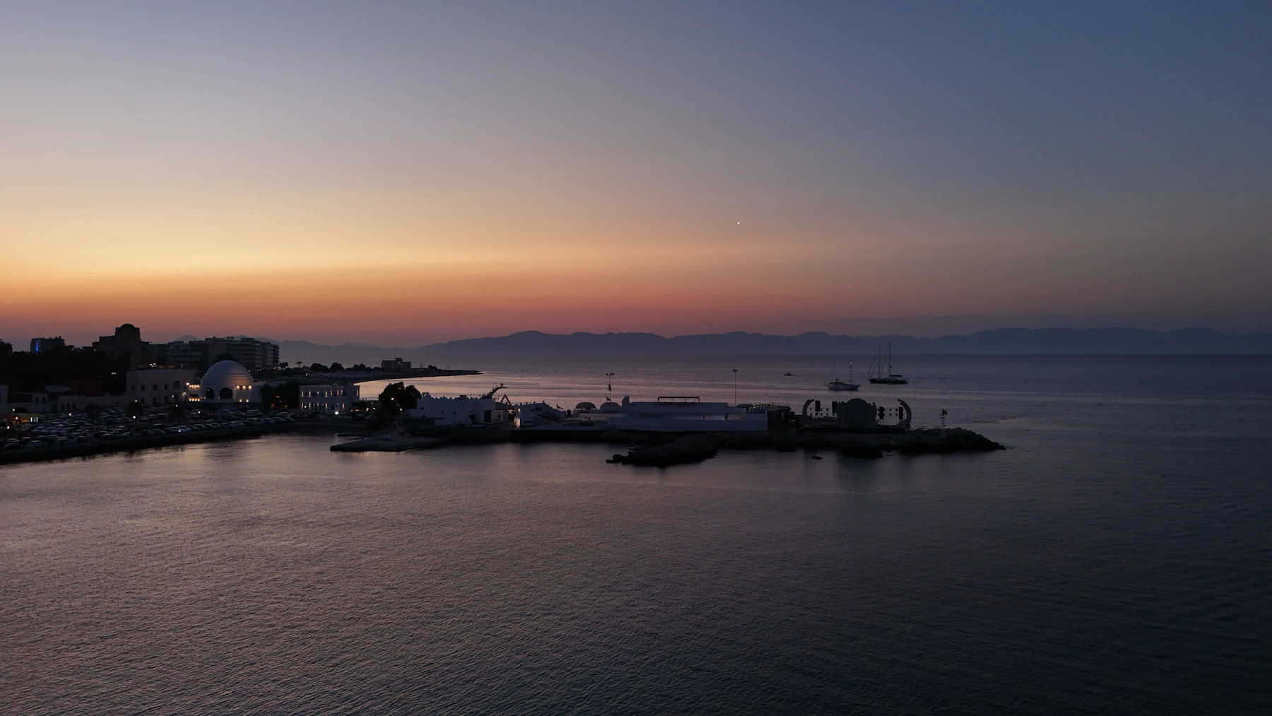 Tangier coastline at dusk — the Strait of Gibraltar from the hillside