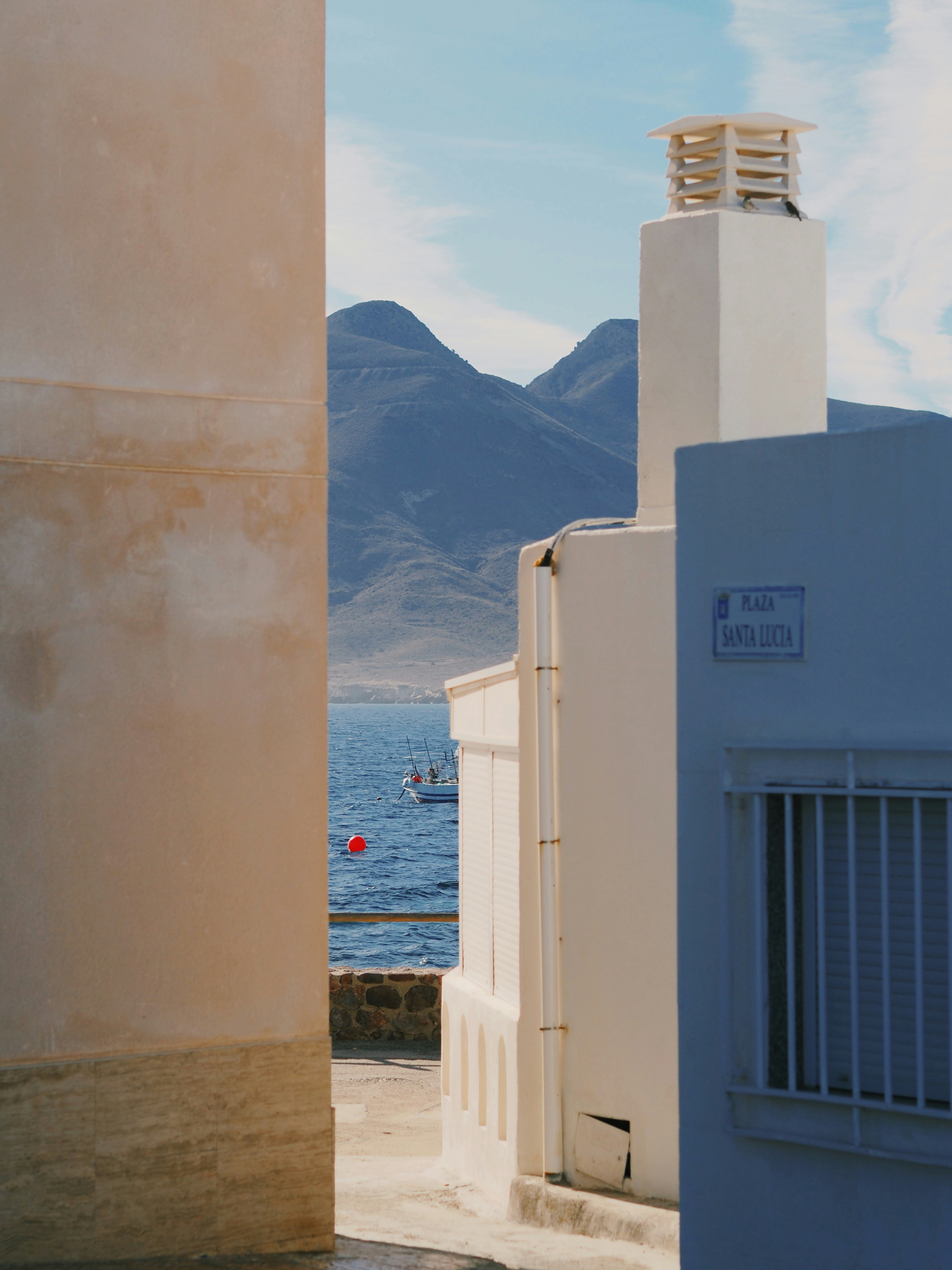 Coastal village with mountains and the sea
