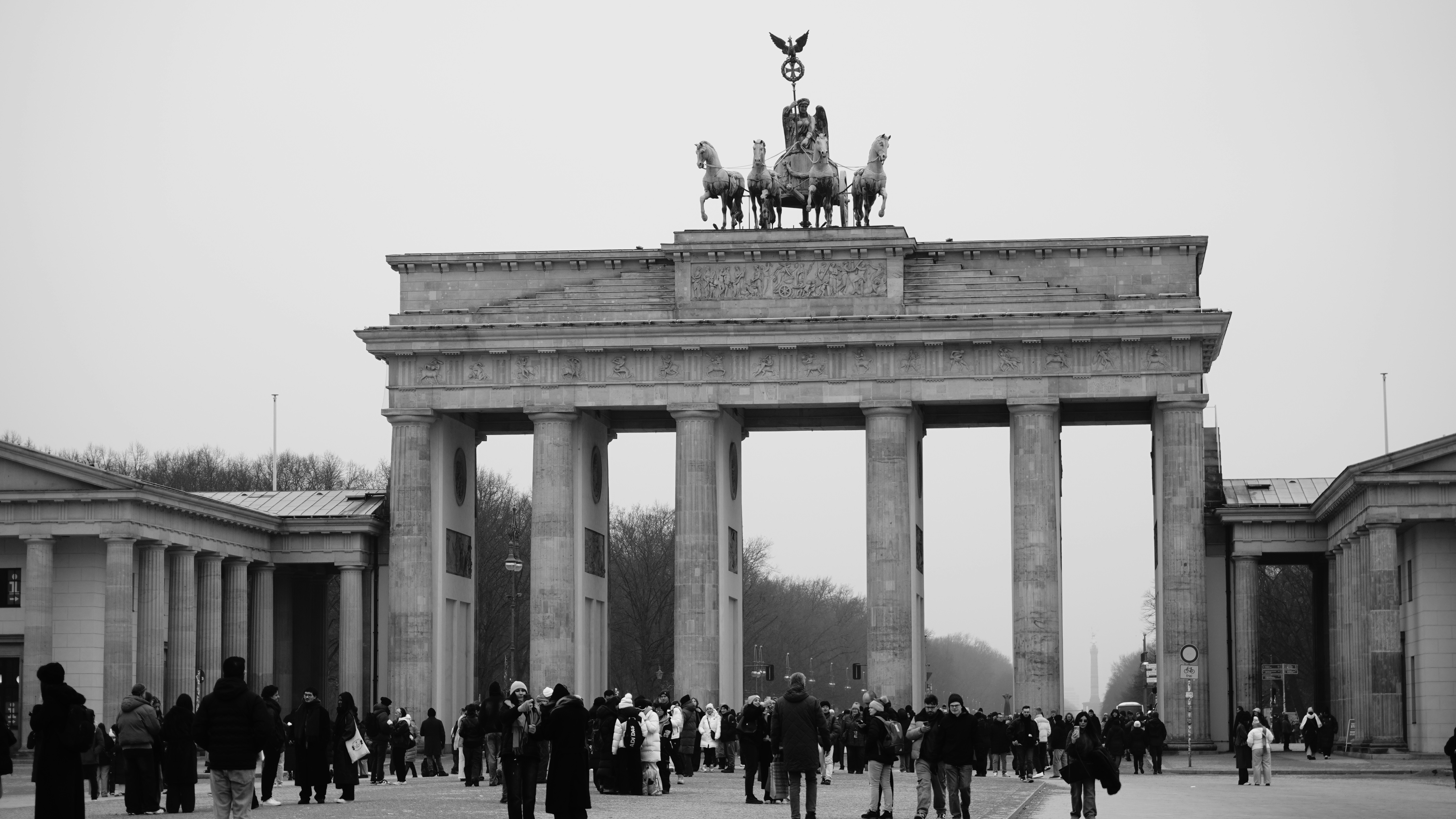Brandenburg gate in berlin with people walking