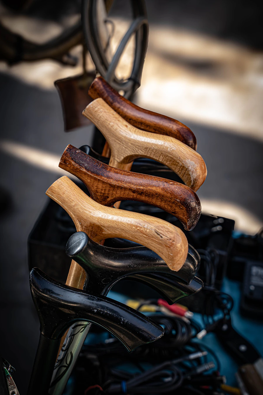 Row of curved wooden cane handles