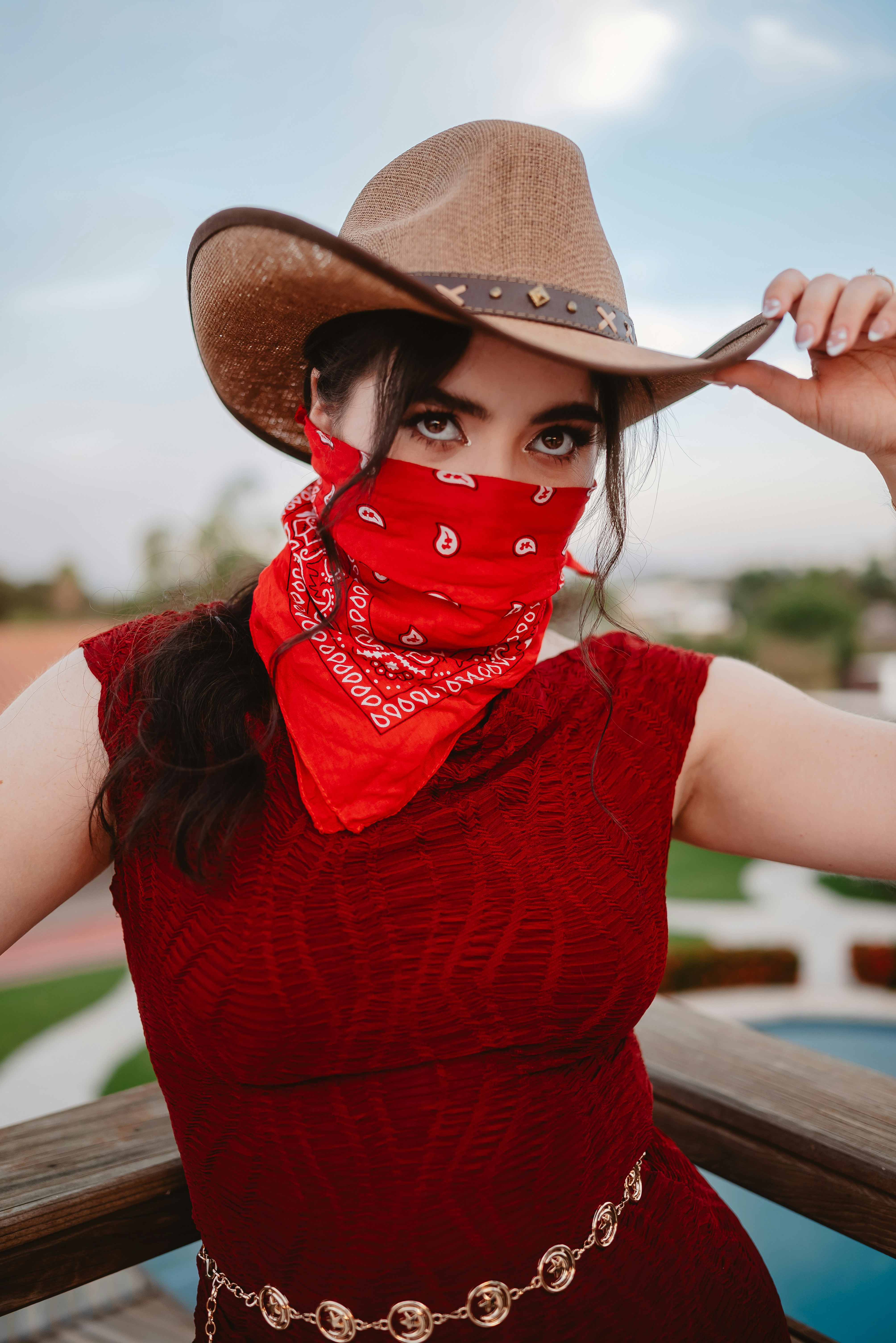 Woman in cowboy hat and red bandana