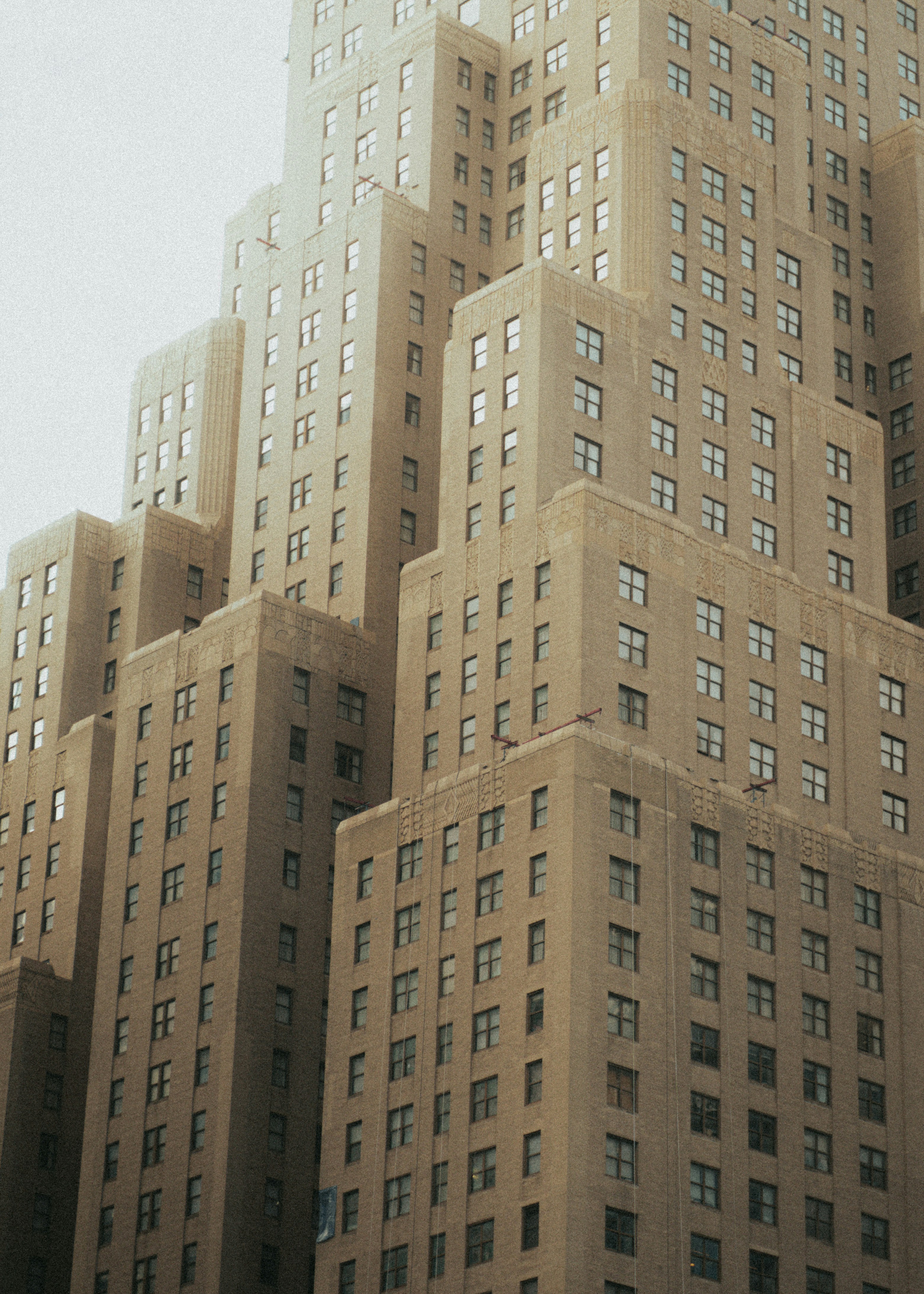 A cluster of tall, beige apartment buildings