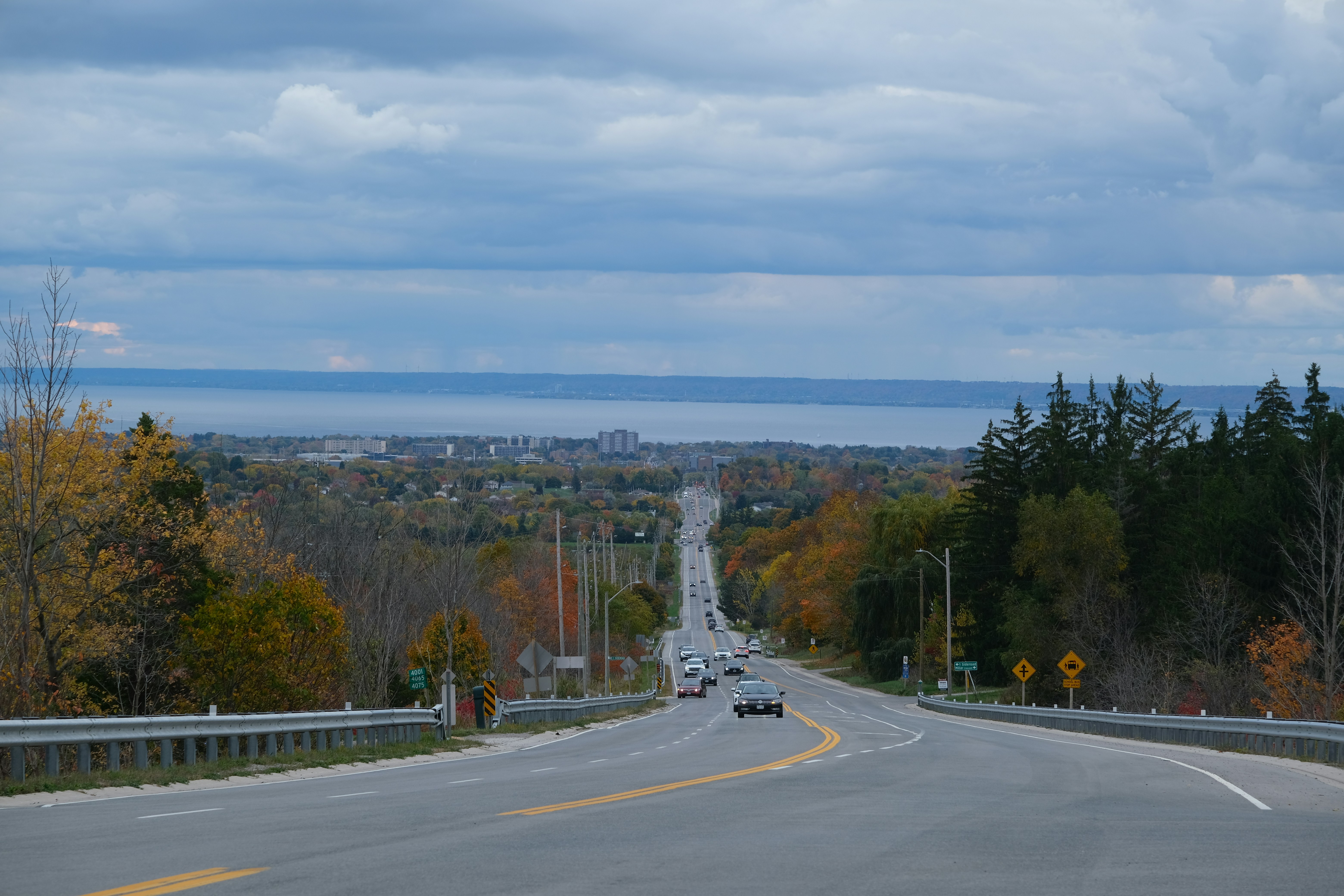 A long, straight road leading to a distant town.