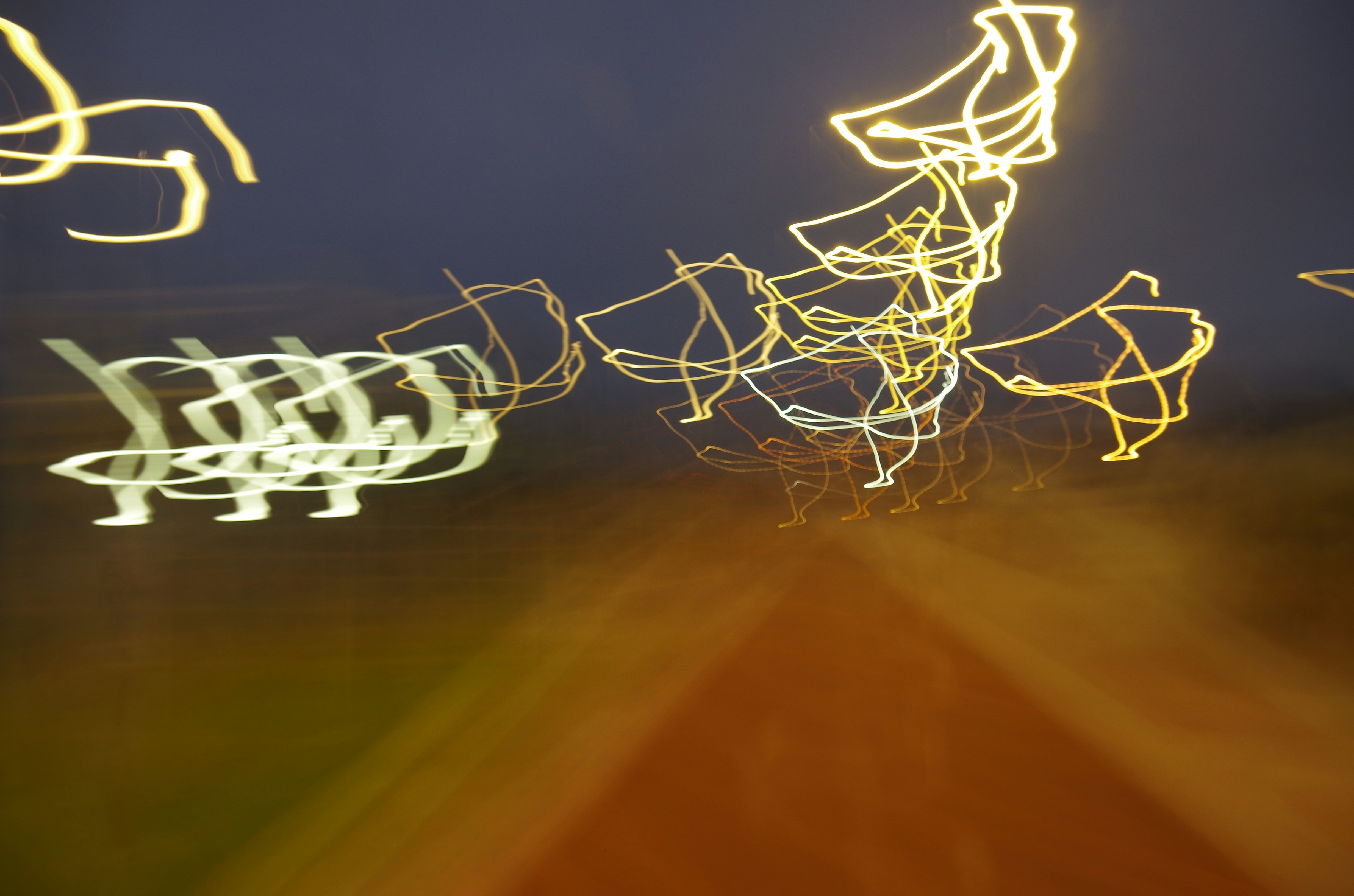 Abstract light trails against dark background