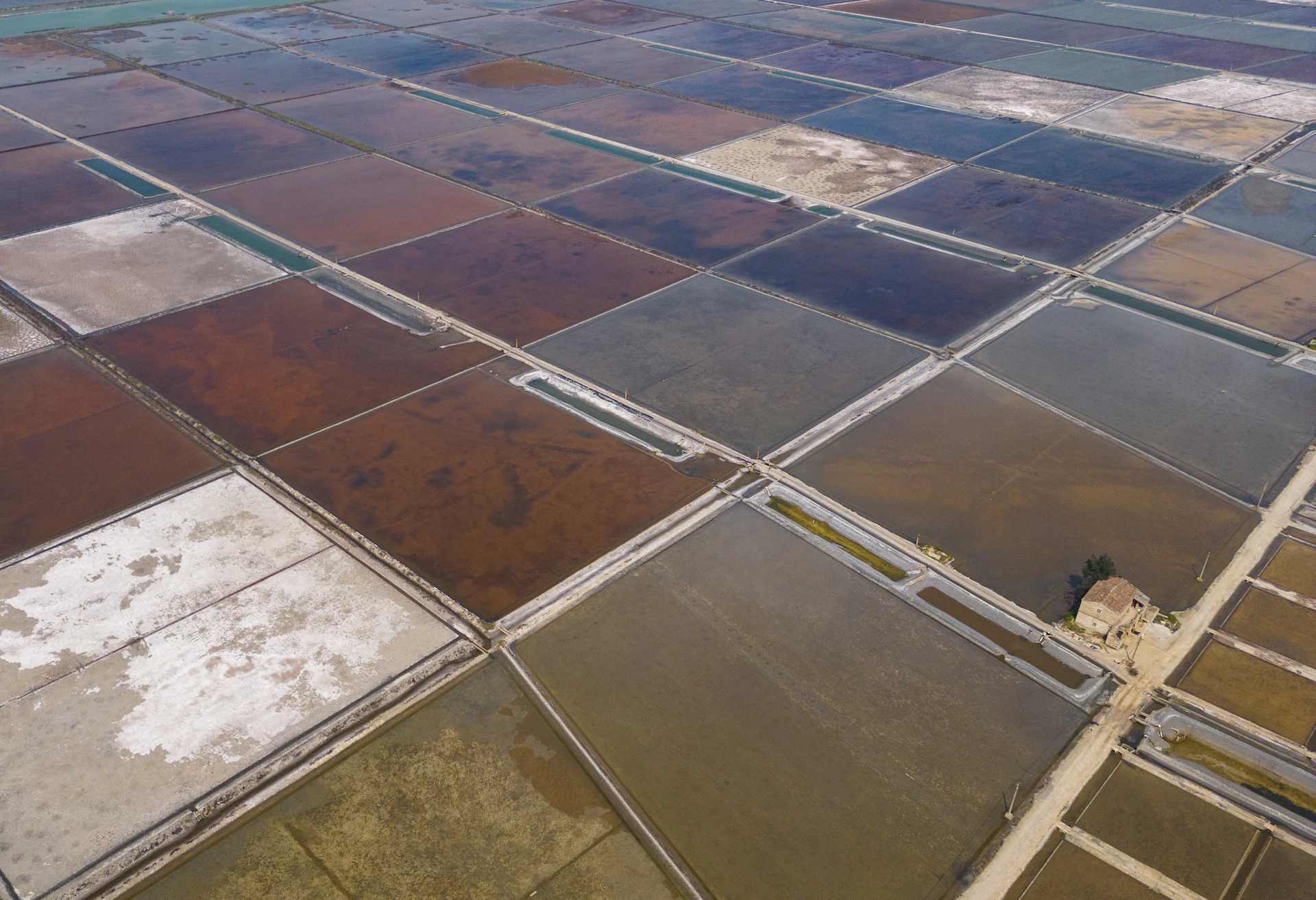 Aerial view of colorful salt evaporation ponds.