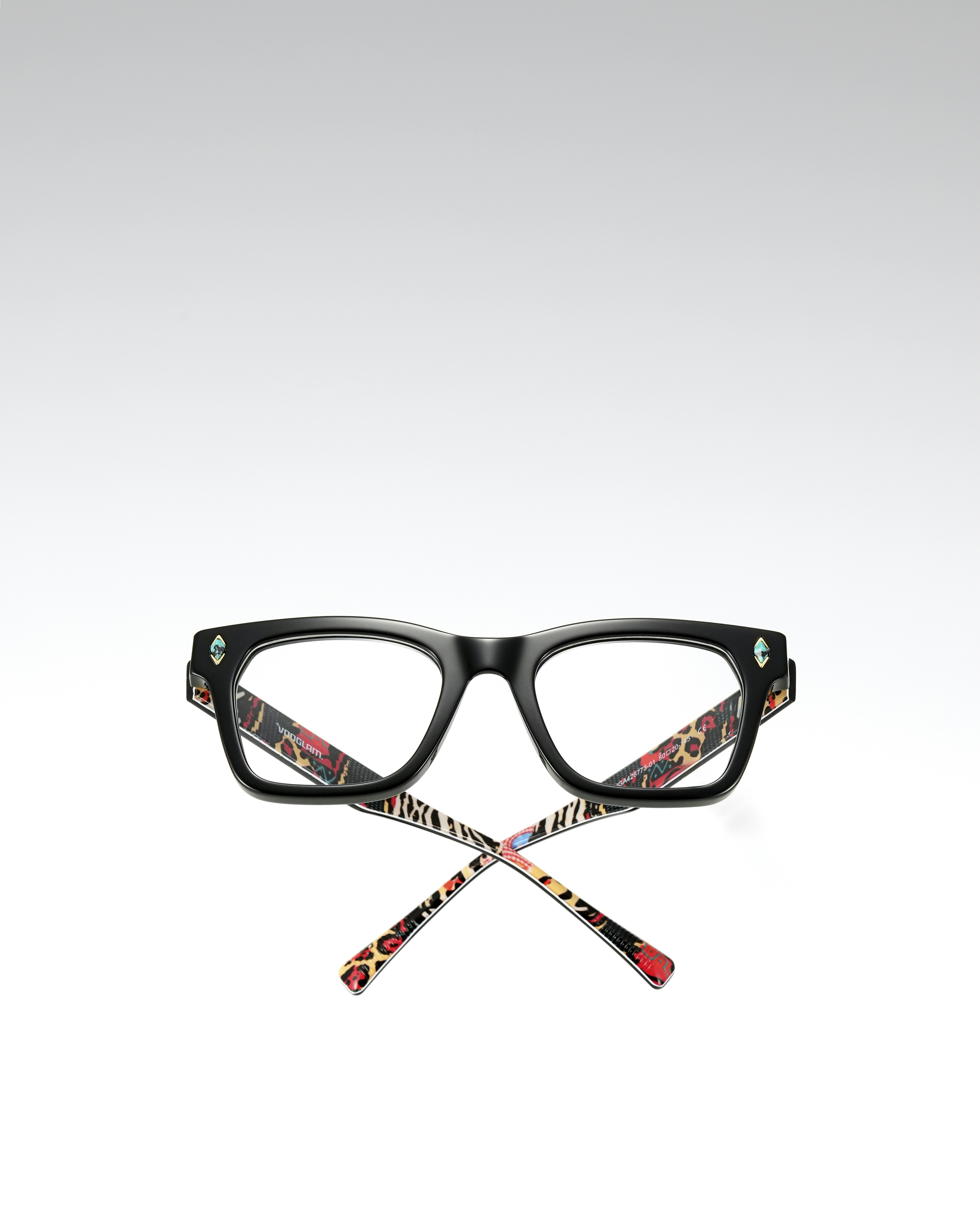 Black eyeglasses with patterned arms and jeweled accents