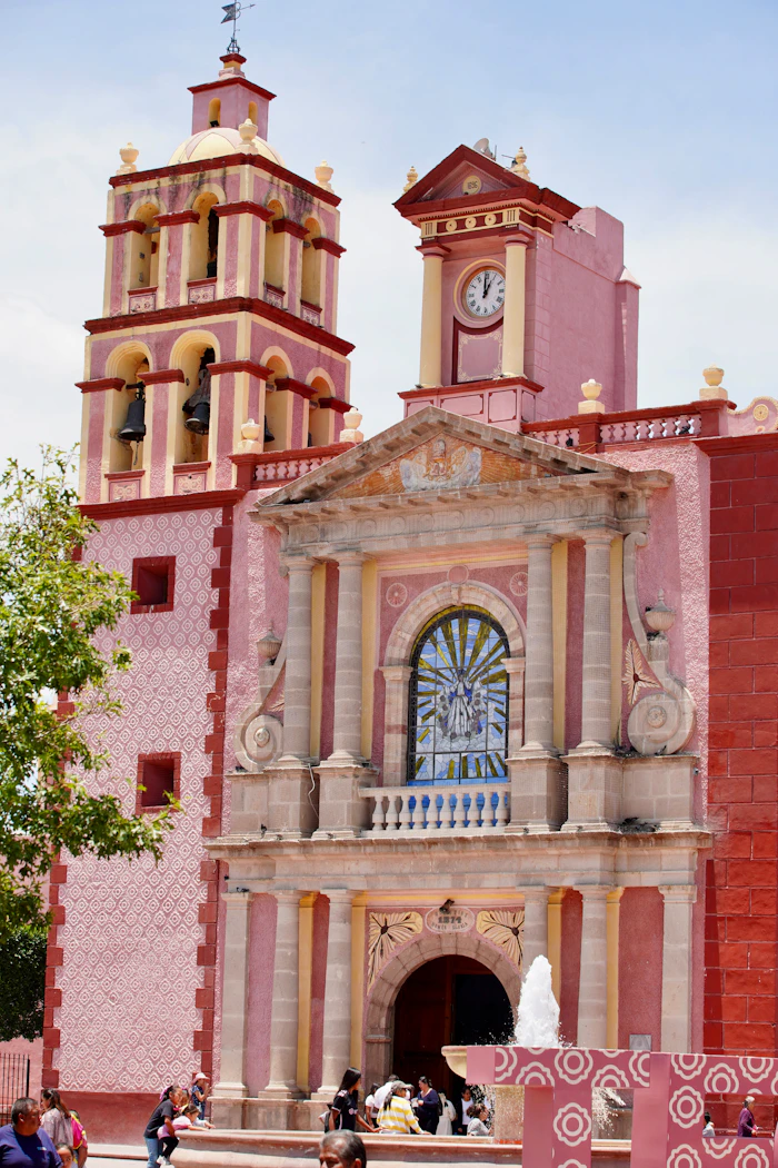 Ornate facade of a pink church