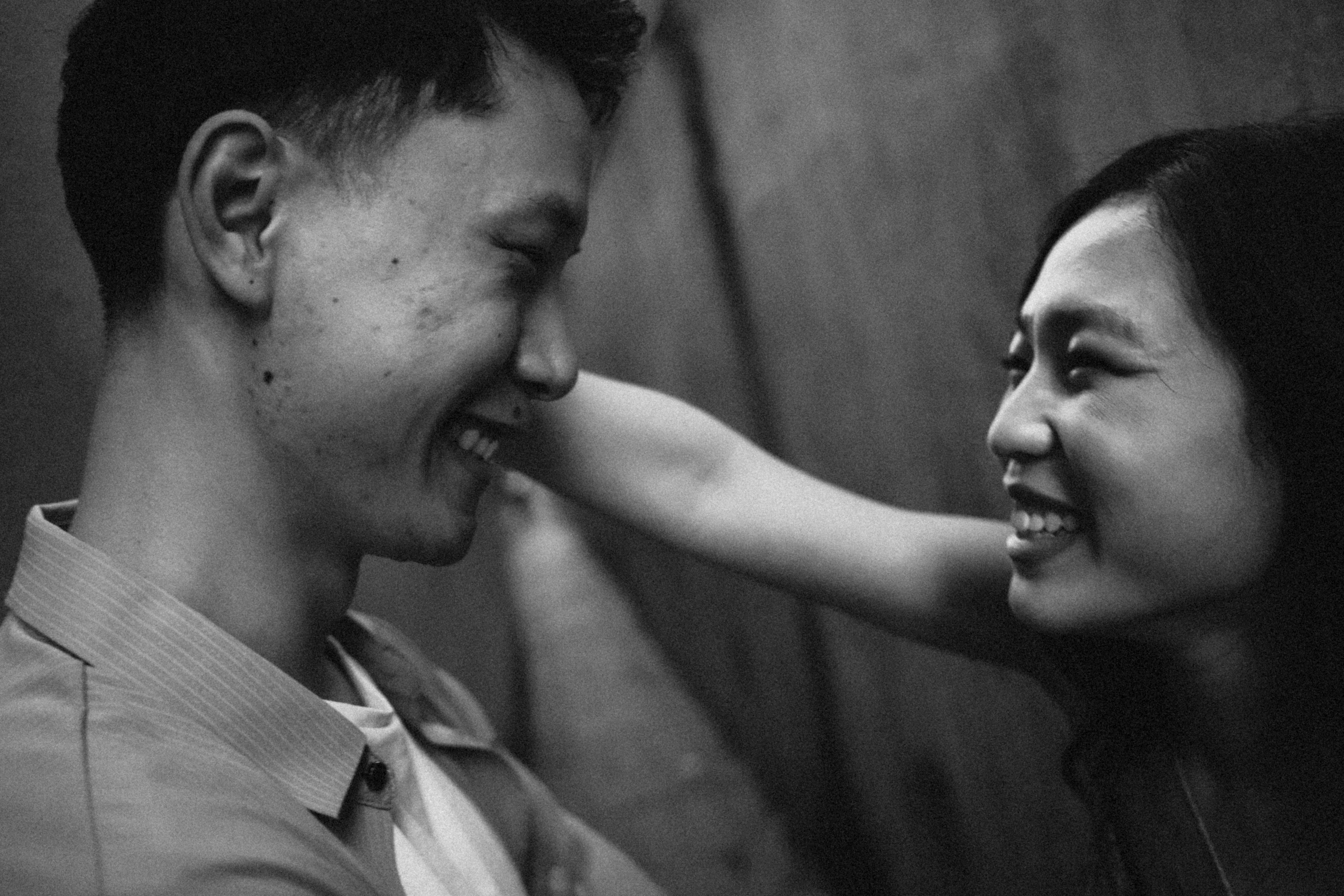 A man and woman smiling at each other