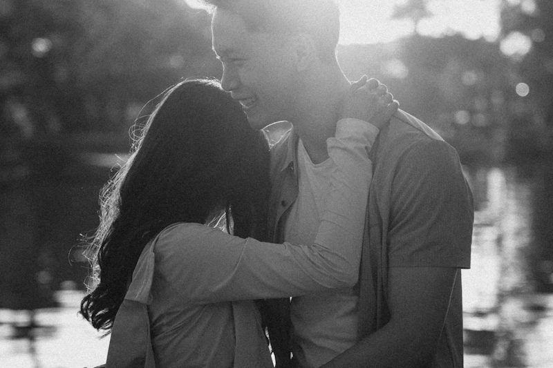 Herpes-aware couple embracing with natural sunlight