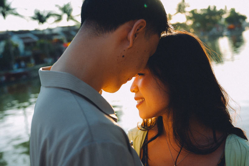 Couple embracing at sunset with warm light