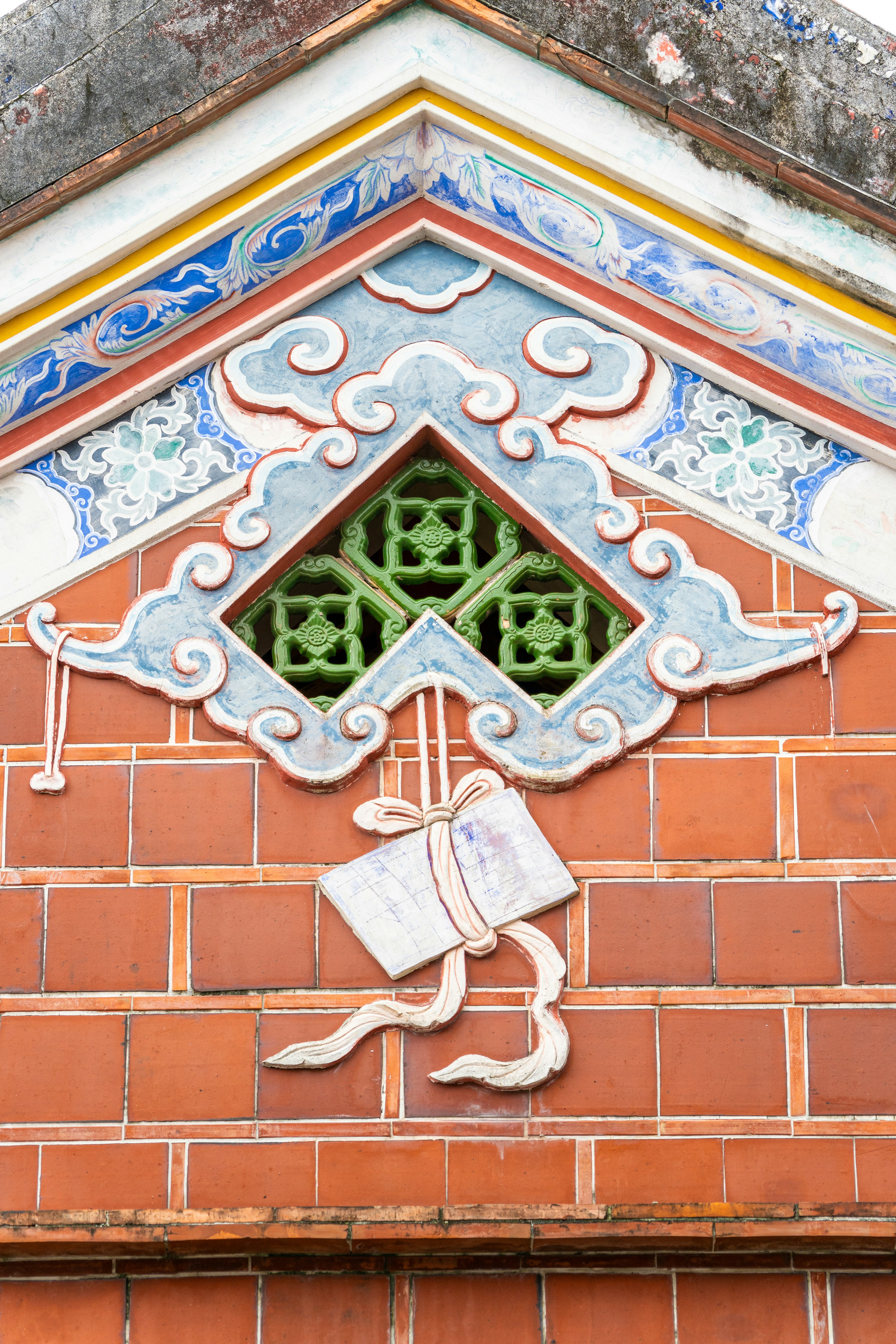 Ornate architectural detail on a tiled building