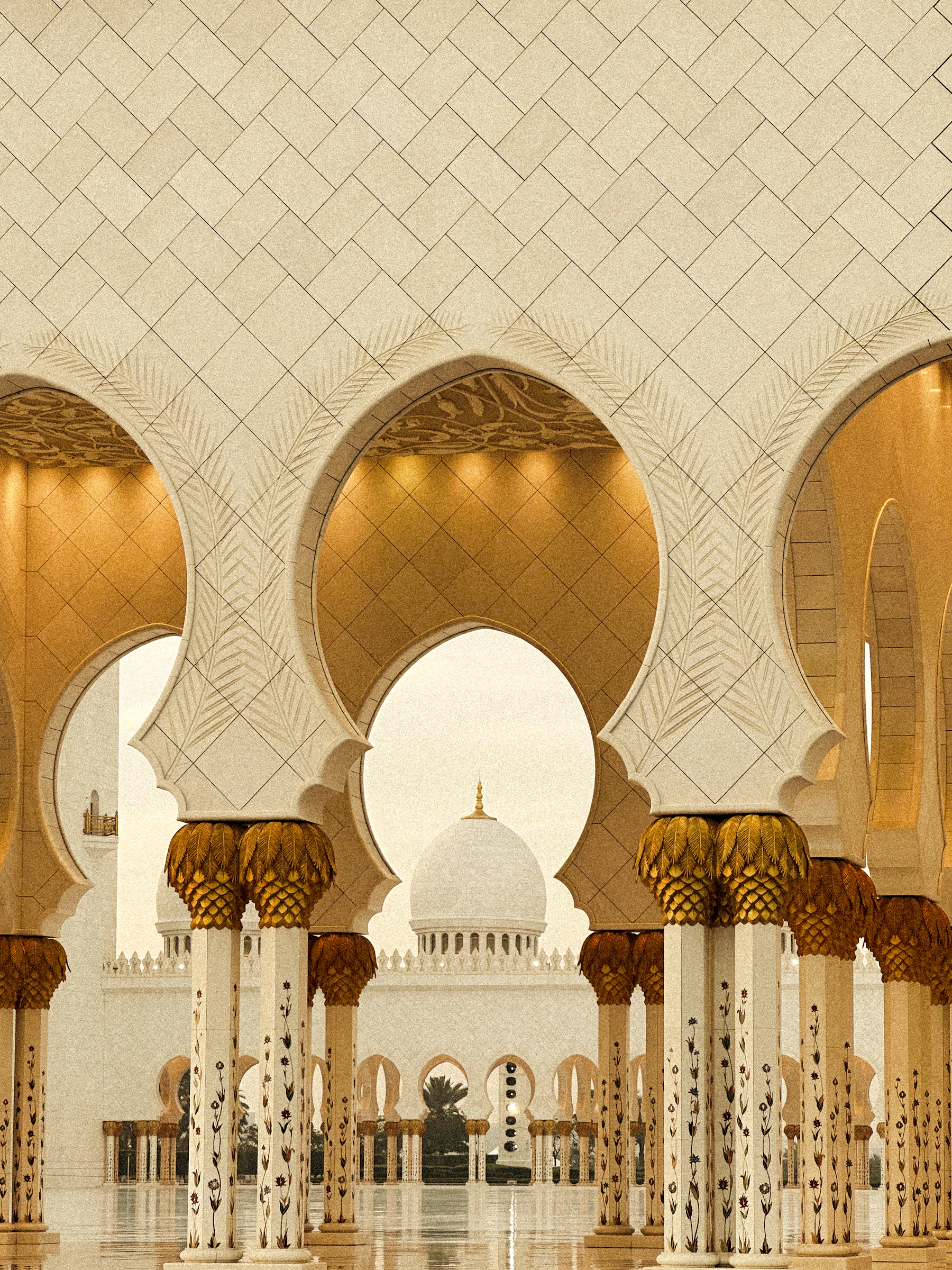 Grand mosque arches and columns bathed in warm golden light