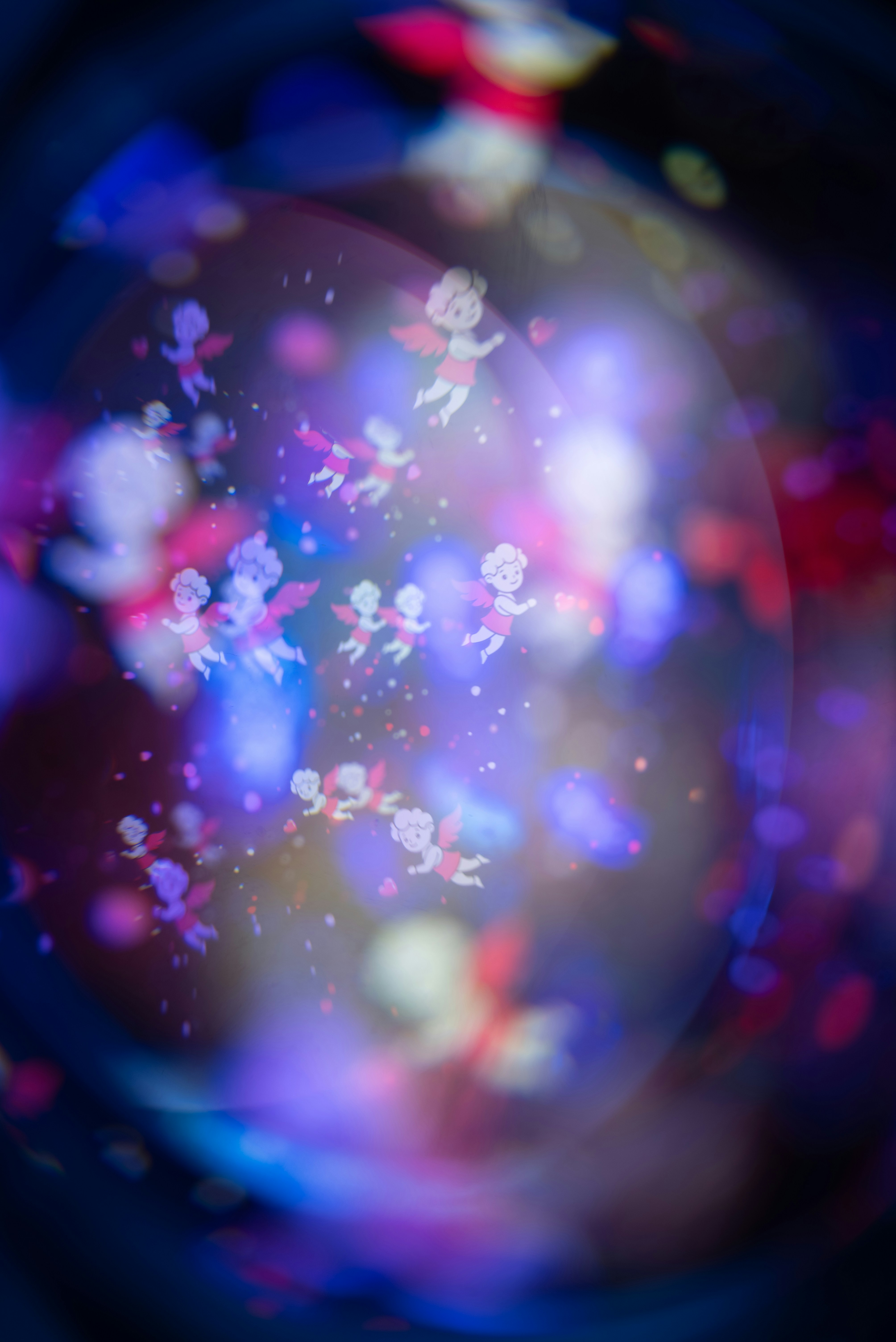 Cupids flying among colorful bokeh lights