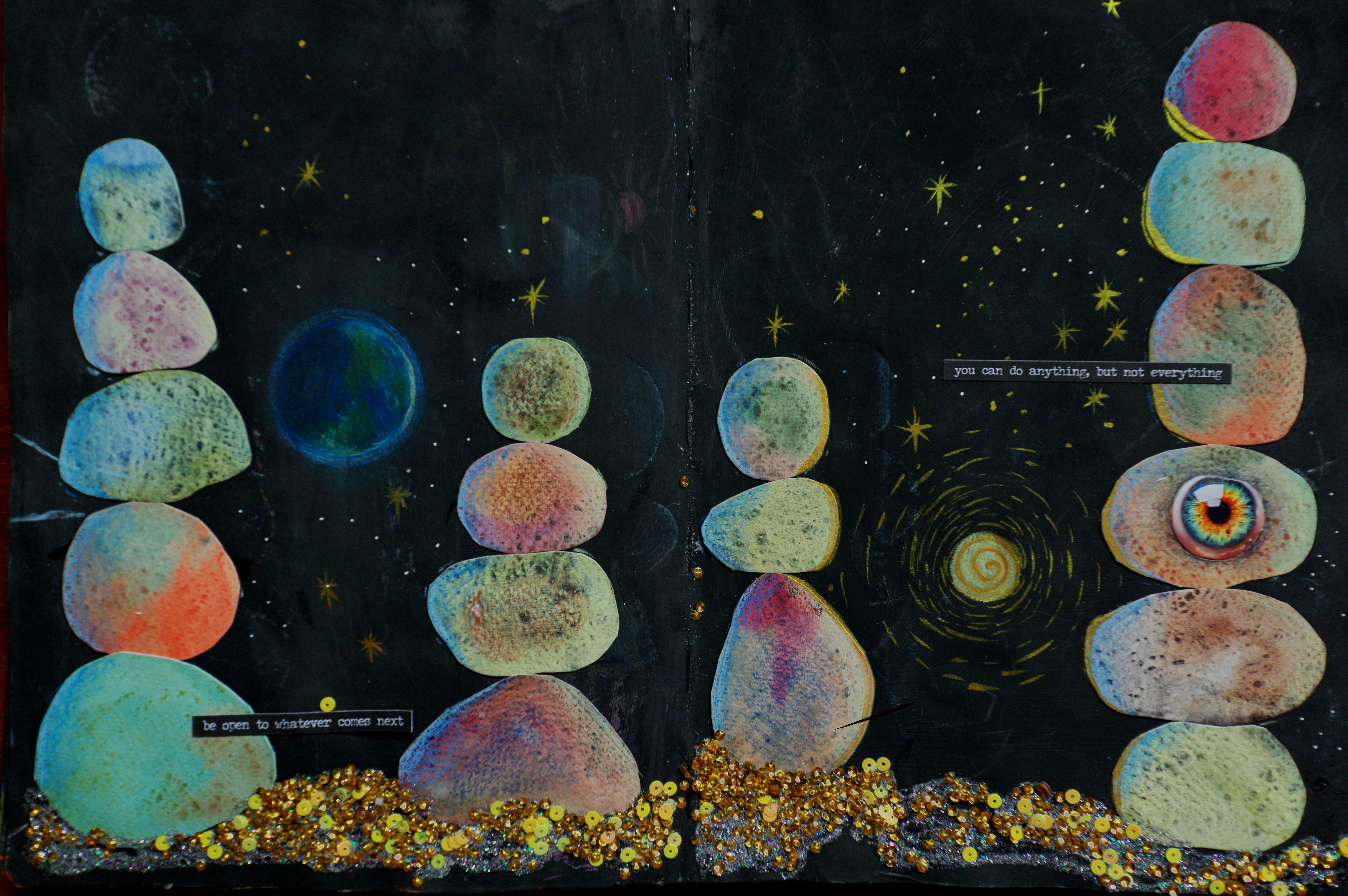 Stacked colorful stones against a starry night sky
