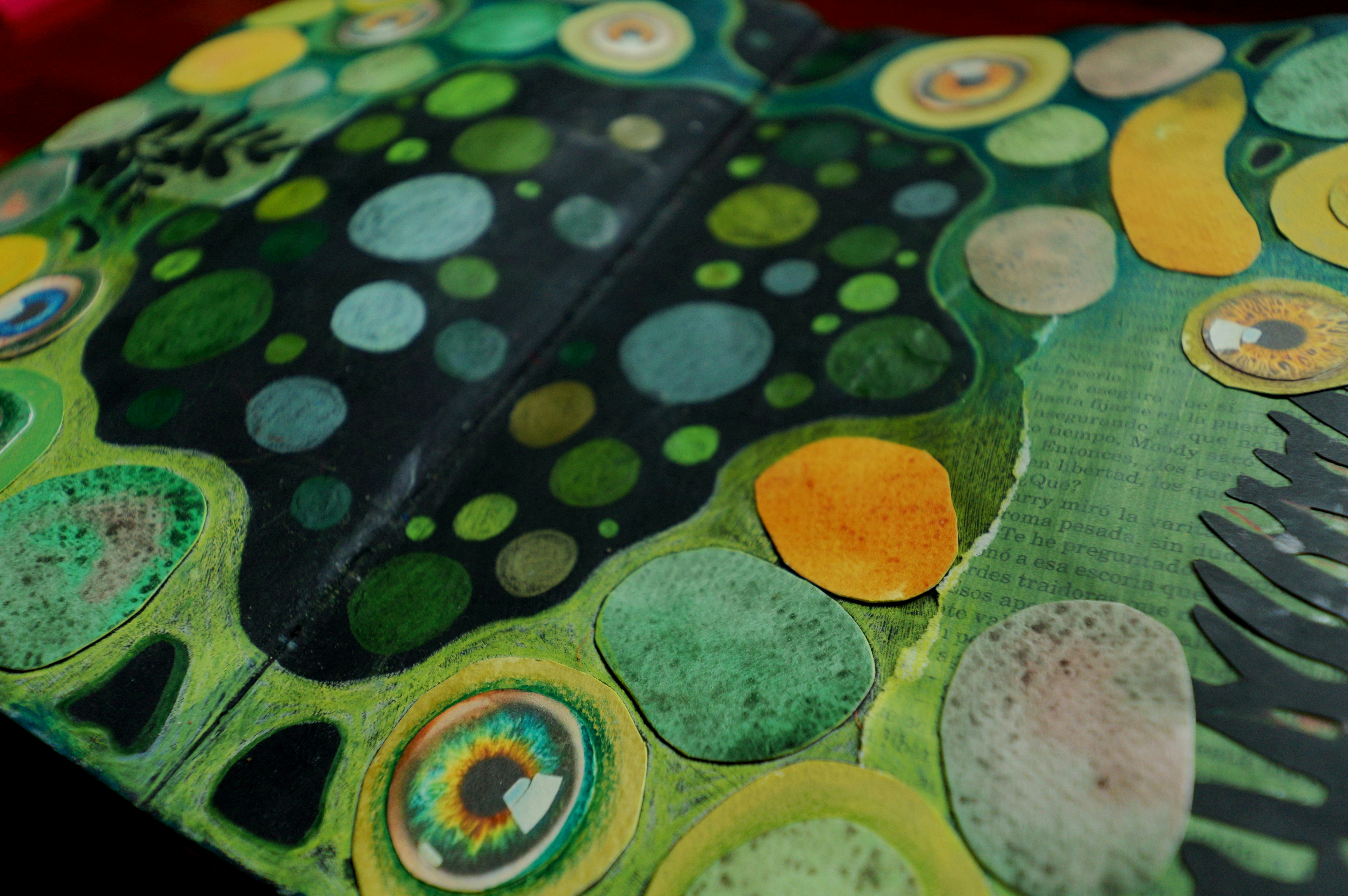 Abstract art with colorful circles and eye motifs