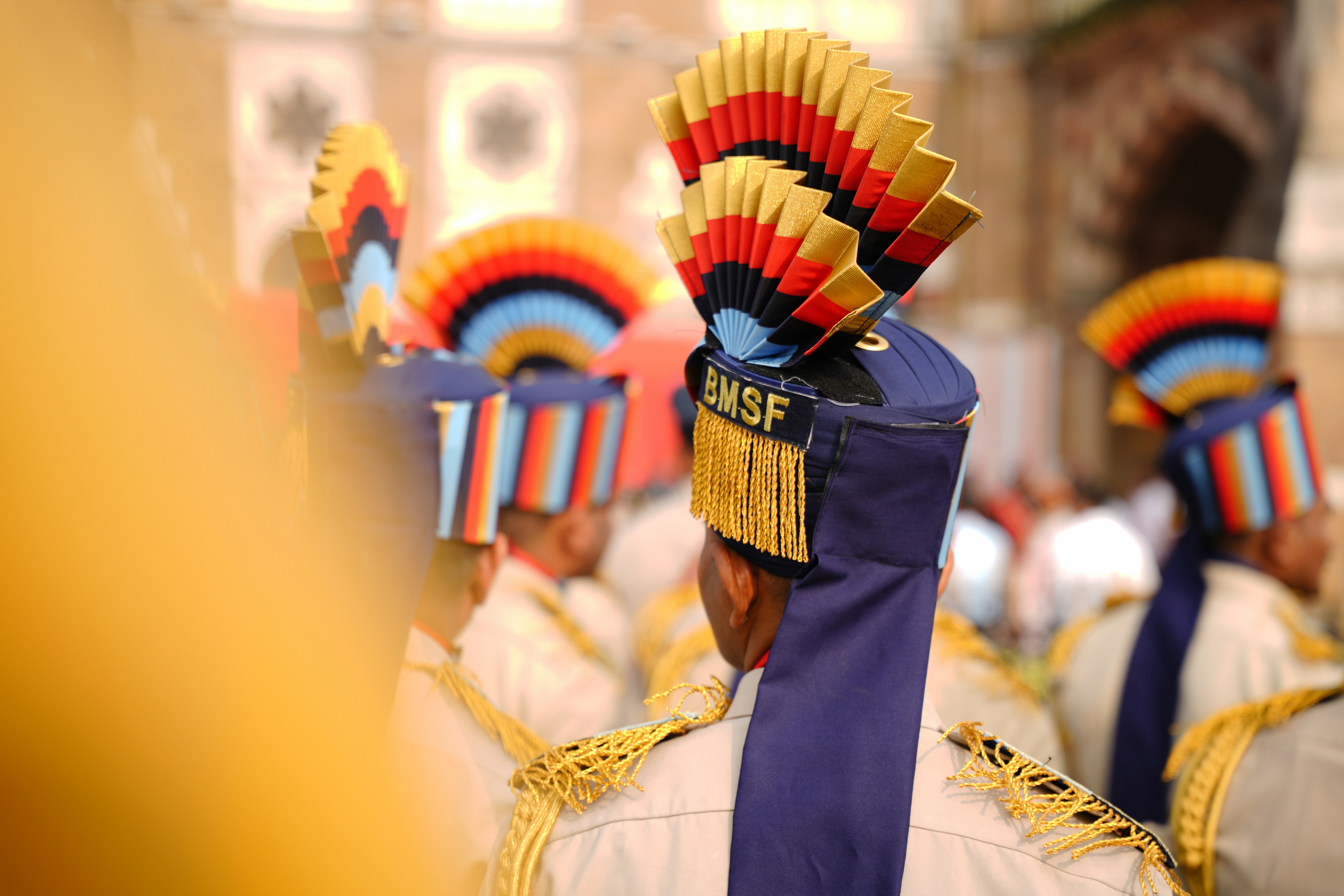 Men in uniform with ornate hats
