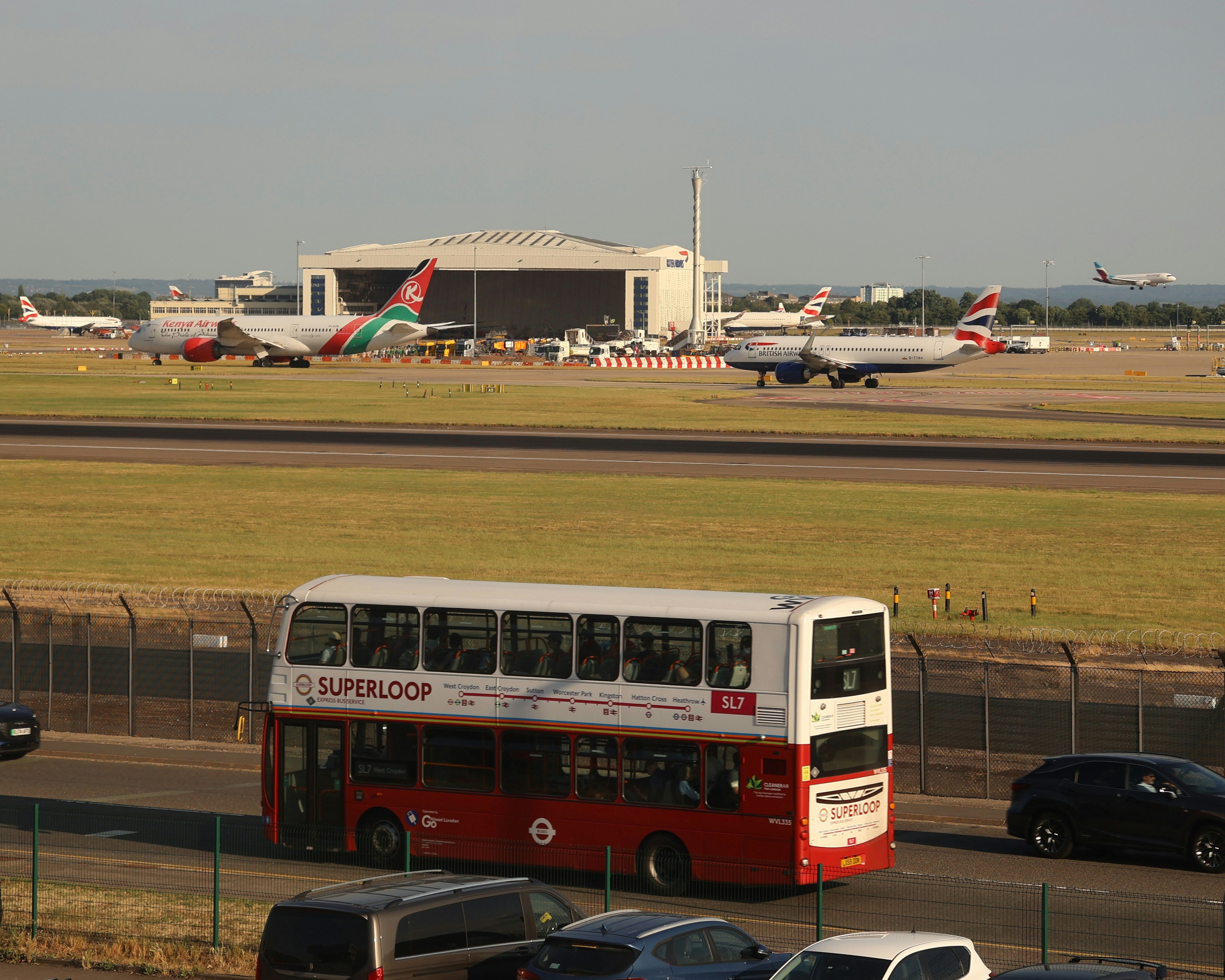 A friendly driver meeting passengers at Heathrow