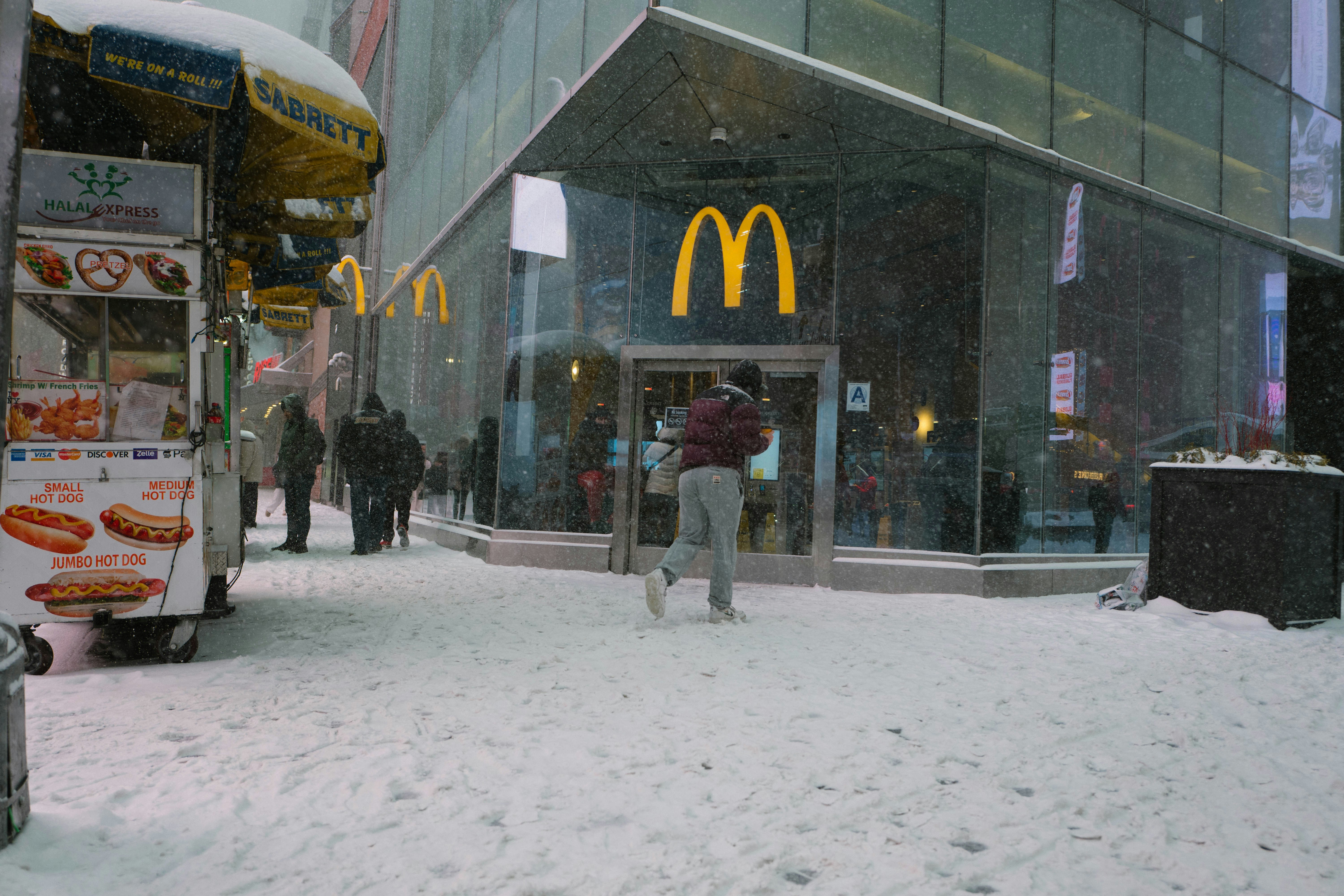 Mcdonald's storefront on a snowy city street
