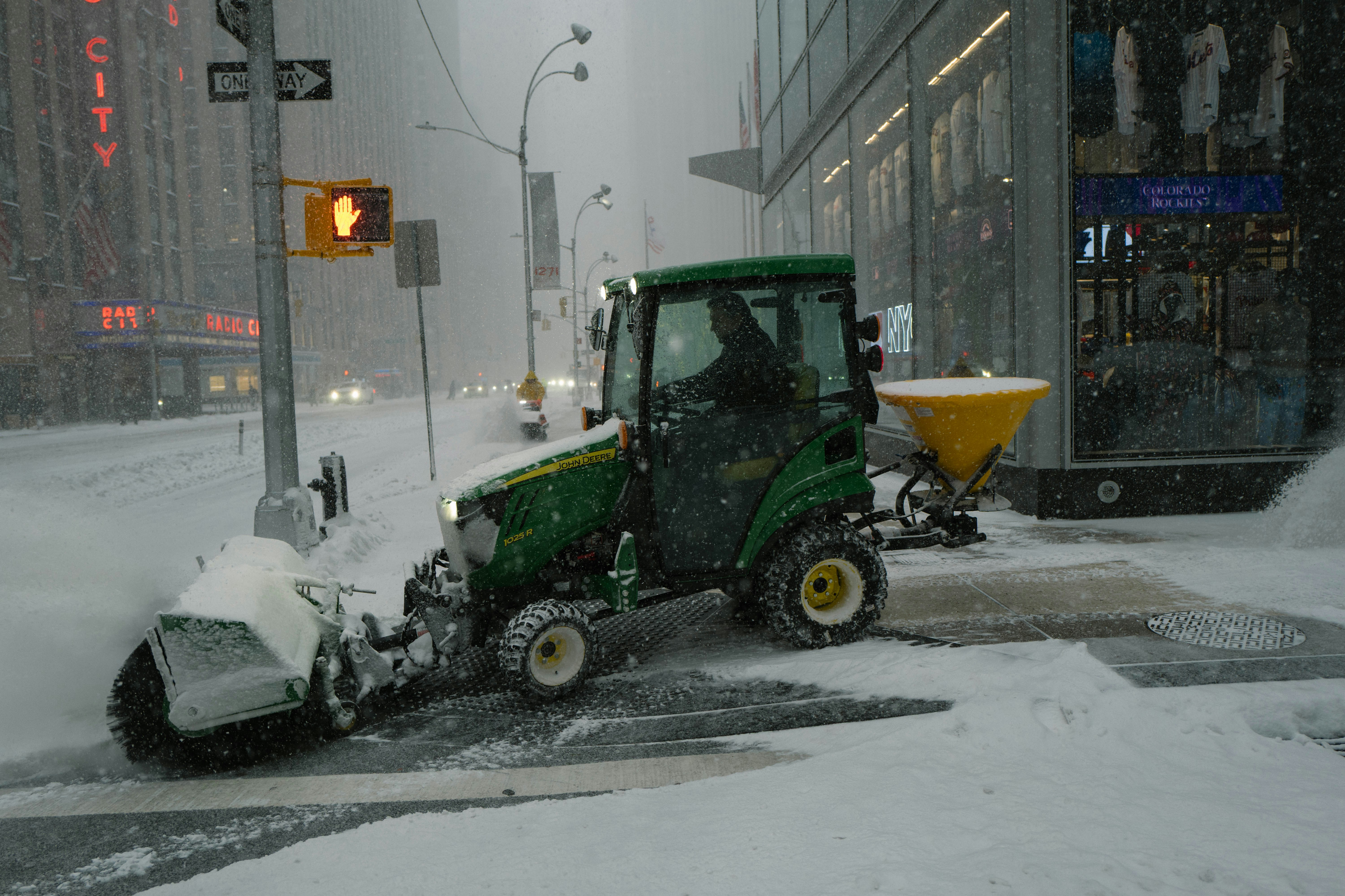 A municipal snowplow clearing a street - Snow removal Lexington MA