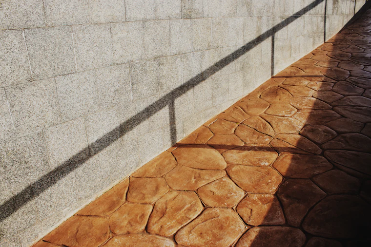 A finished decorative concrete driveway.