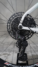 Close-up of a bicycle's rear derailleur and cassette.