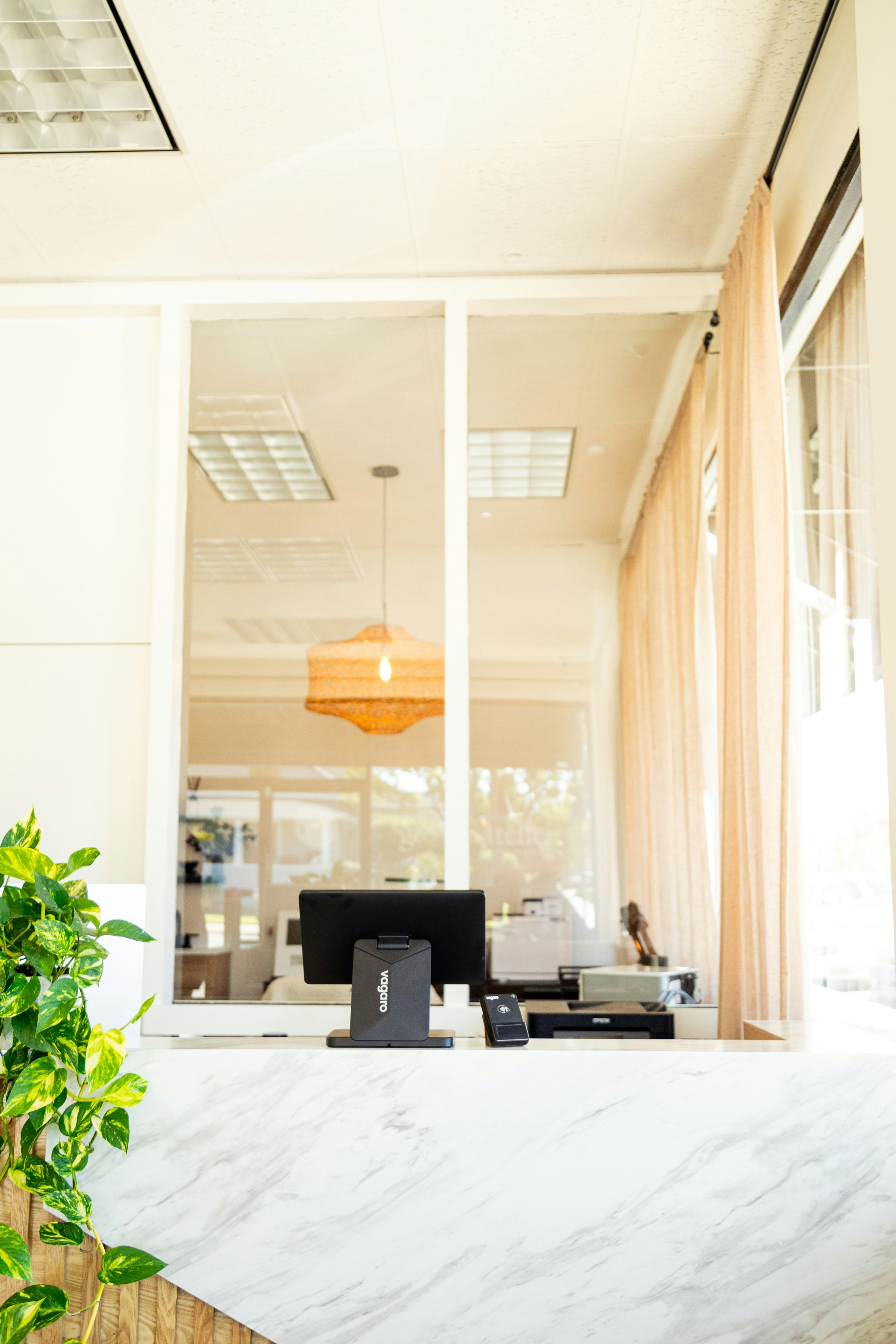 Reception desk with computer and printer.