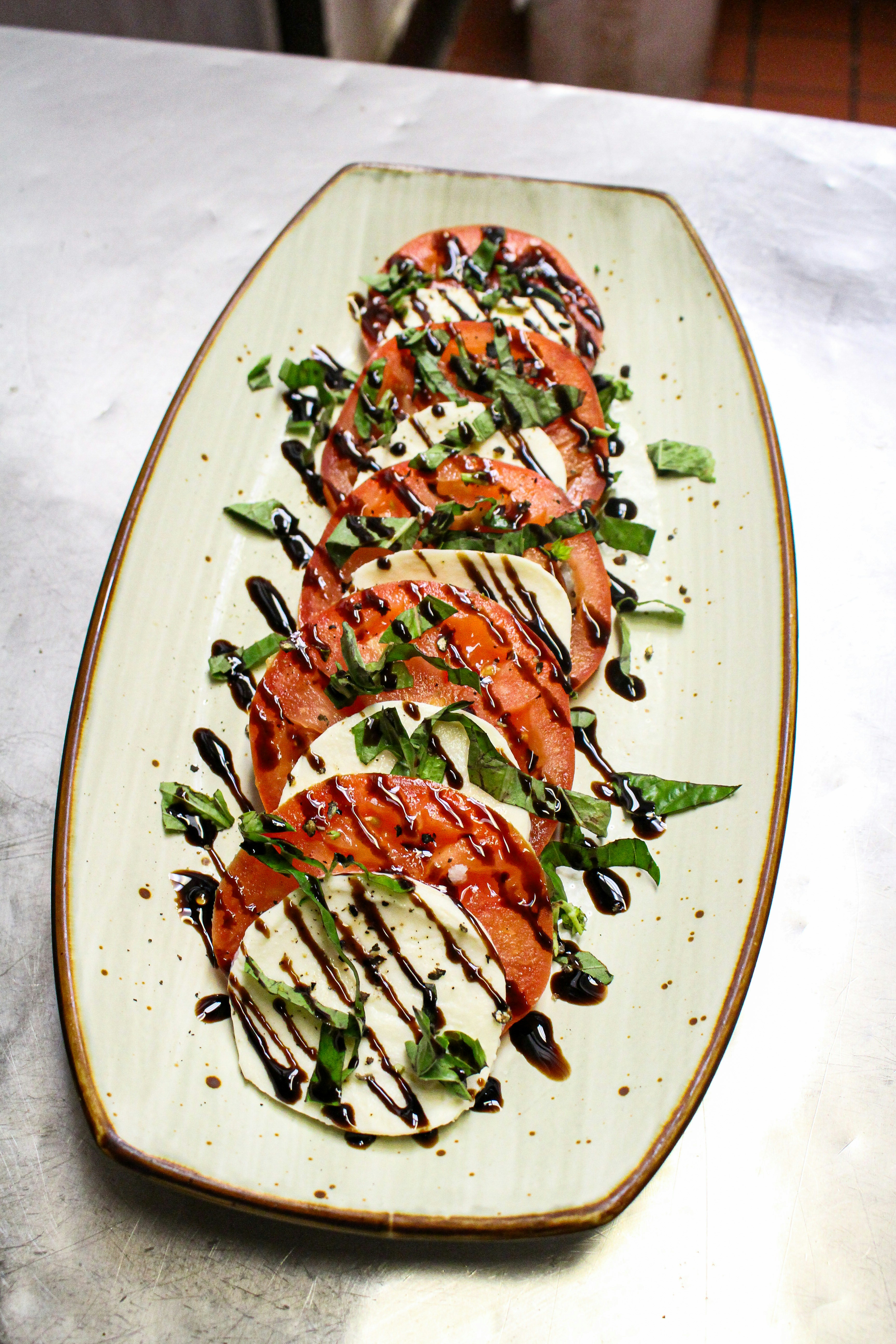 Caprese salad with tomatoes, mozzarella, and basil
