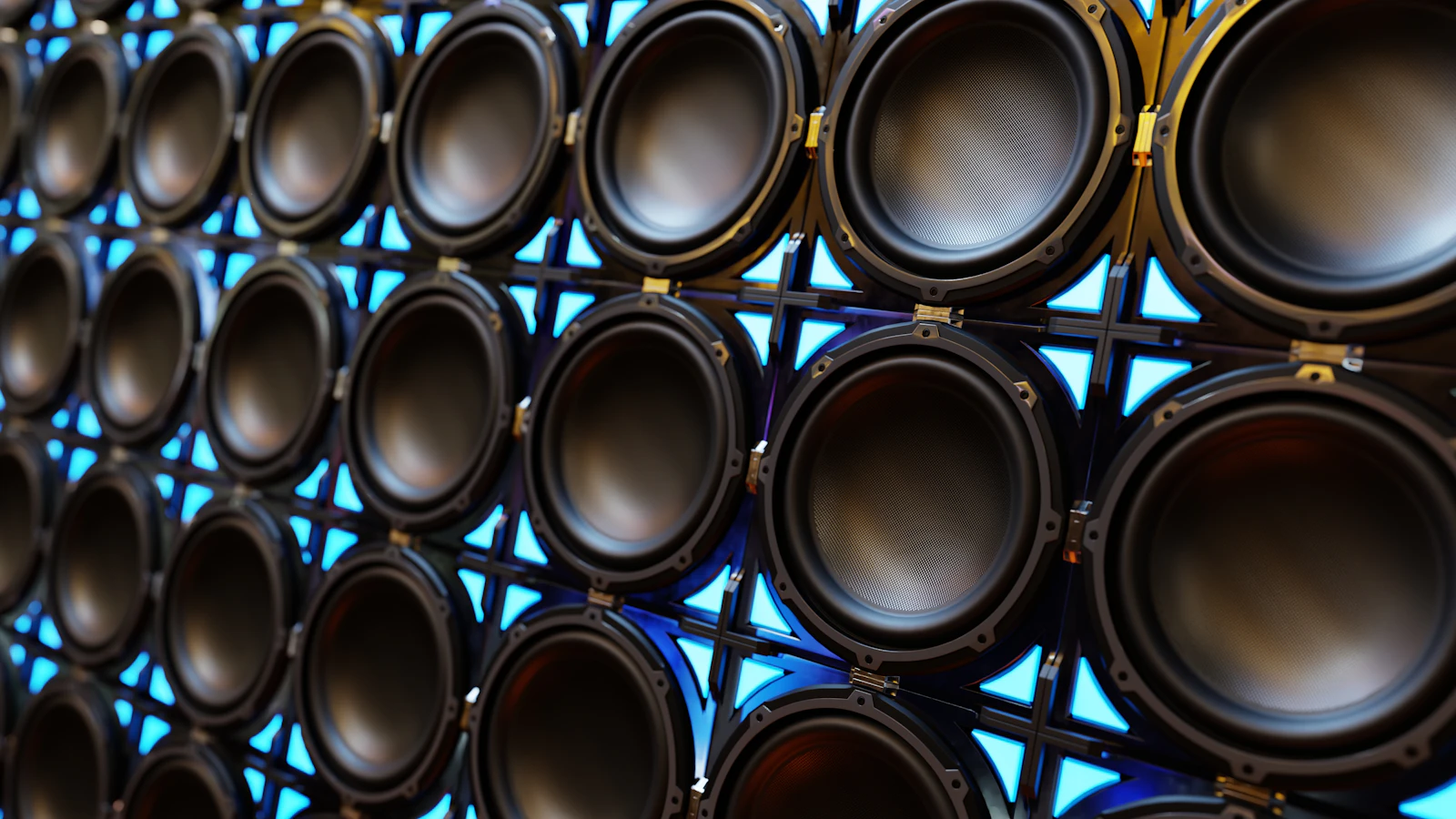 A backlit wall of speaker cones