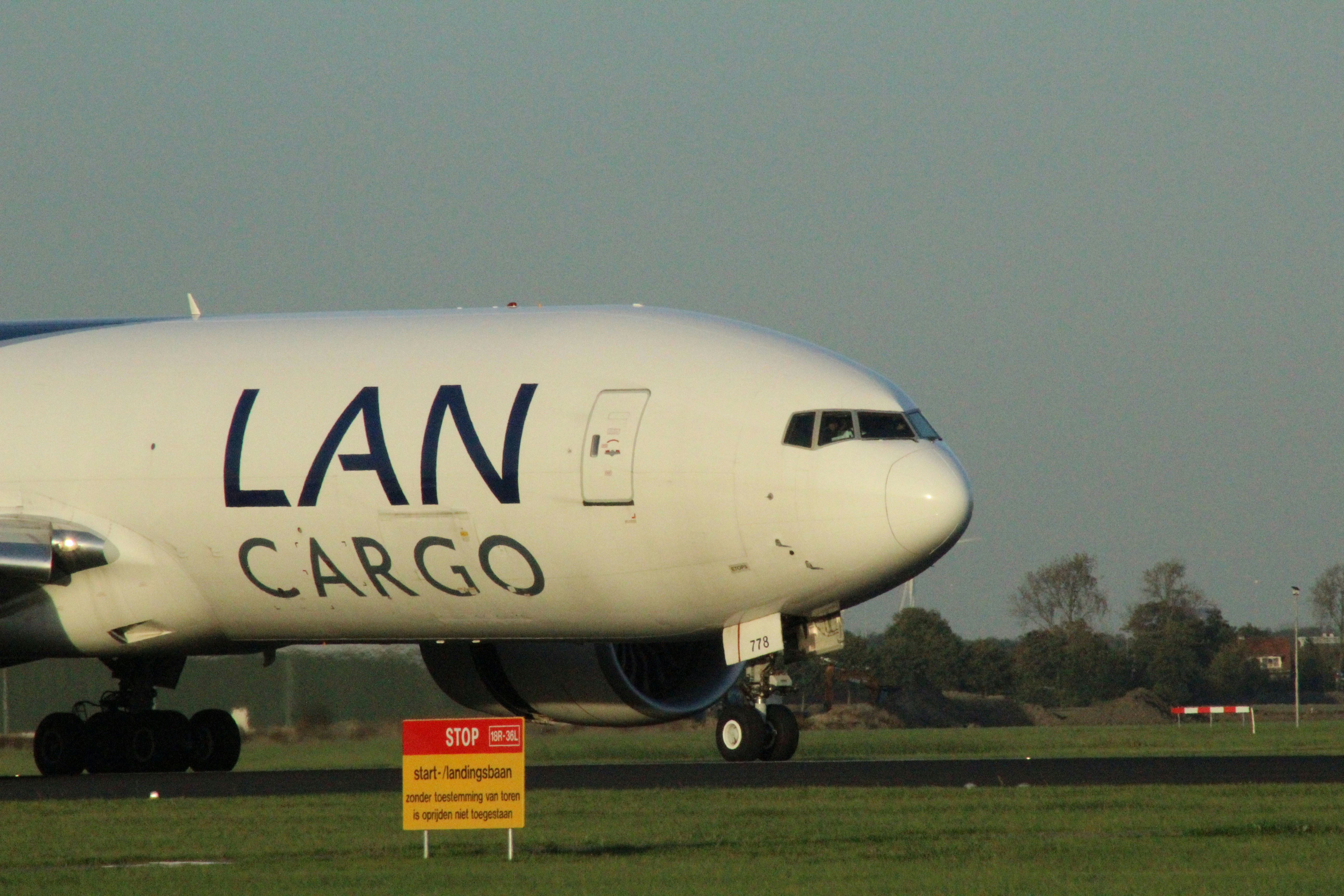 A white lan cargo airplane on a runway.