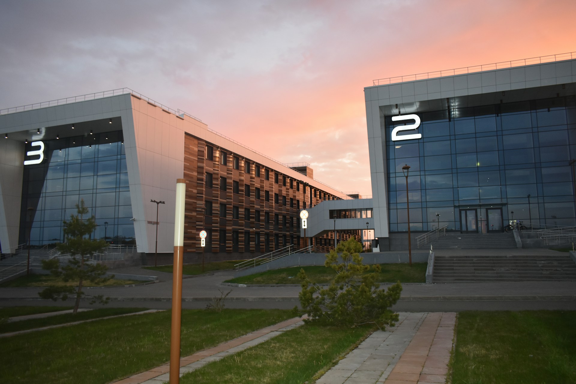 Modern buildings with numbers 2 and 3 at sunset