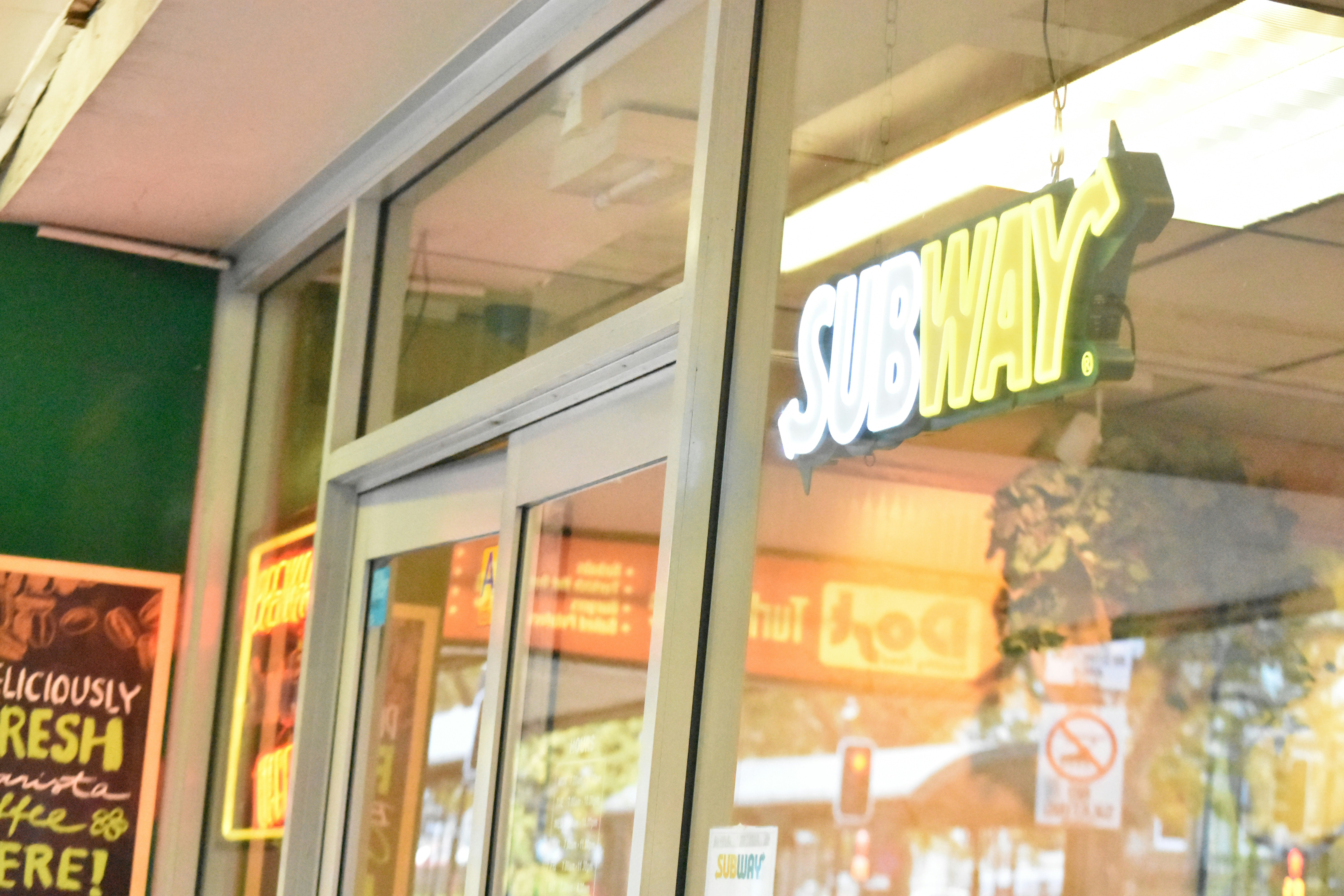 Subway restaurant exterior with illuminated sign
