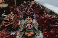Traditional hand-carved Balinese wooden masks for sale, a popular souvenir