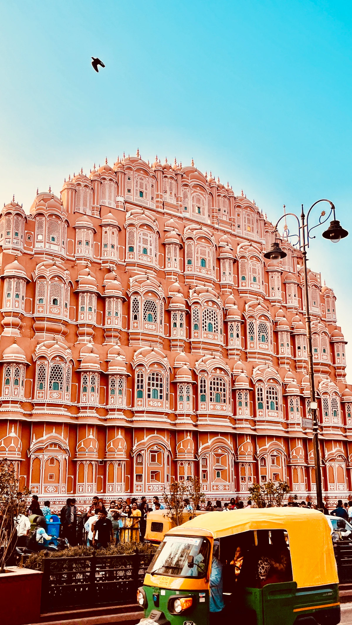 The Hawa Mahal facade on a busy street in Jaipur