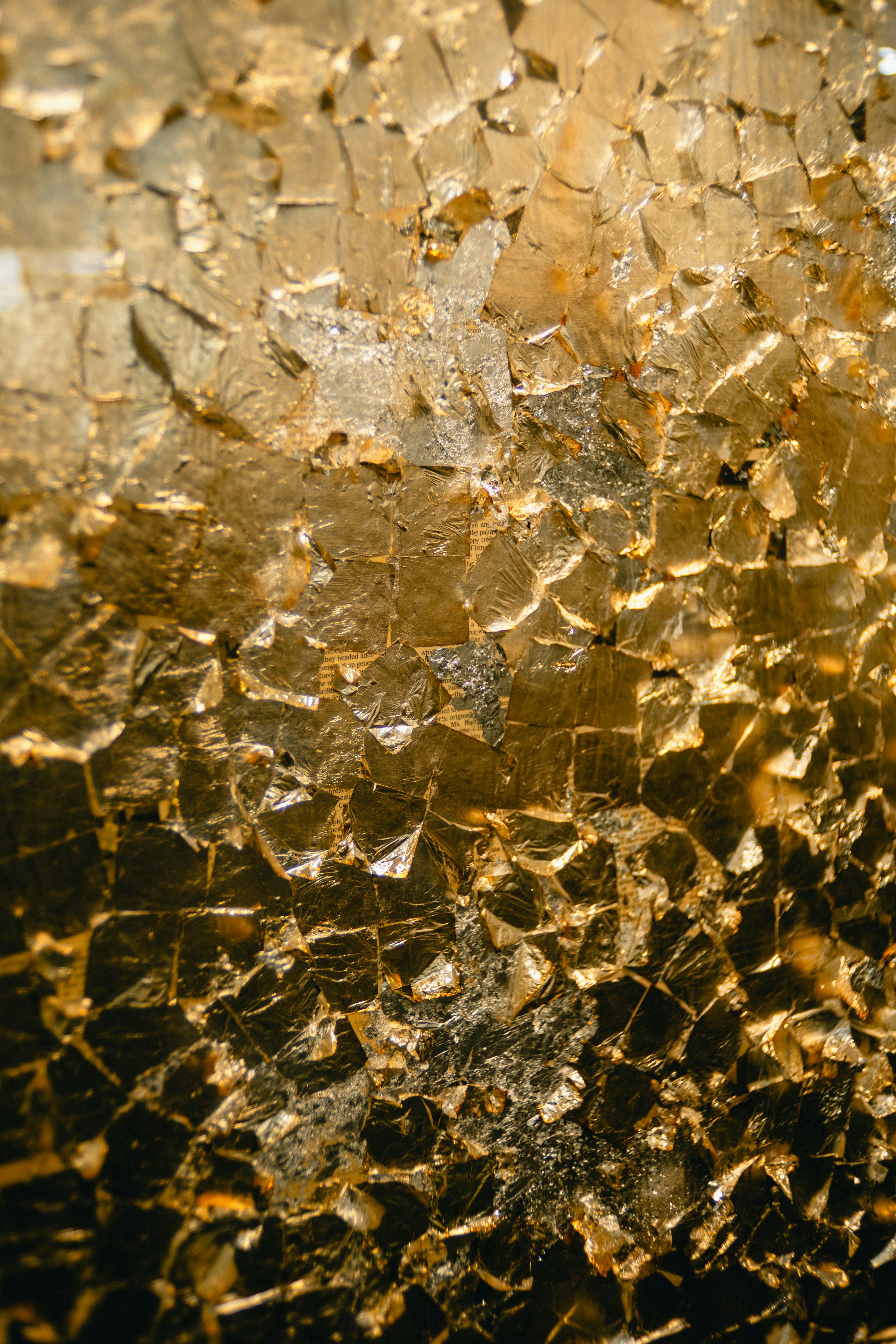 Close-up of golden textured surface with geometric patterns