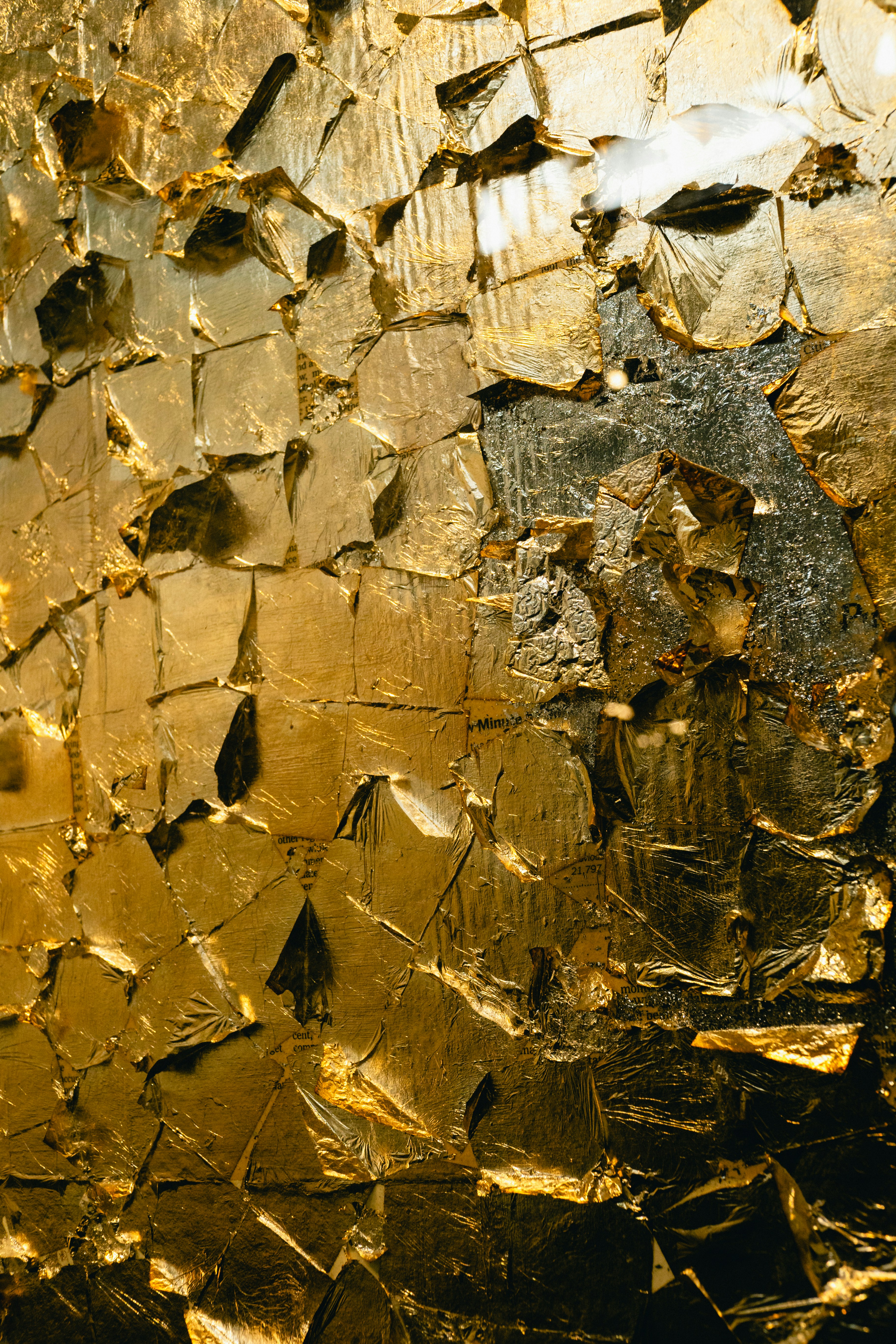 Abstract texture of golden crumpled foil.