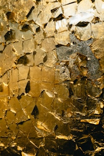 Abstract texture of golden crumpled foil.