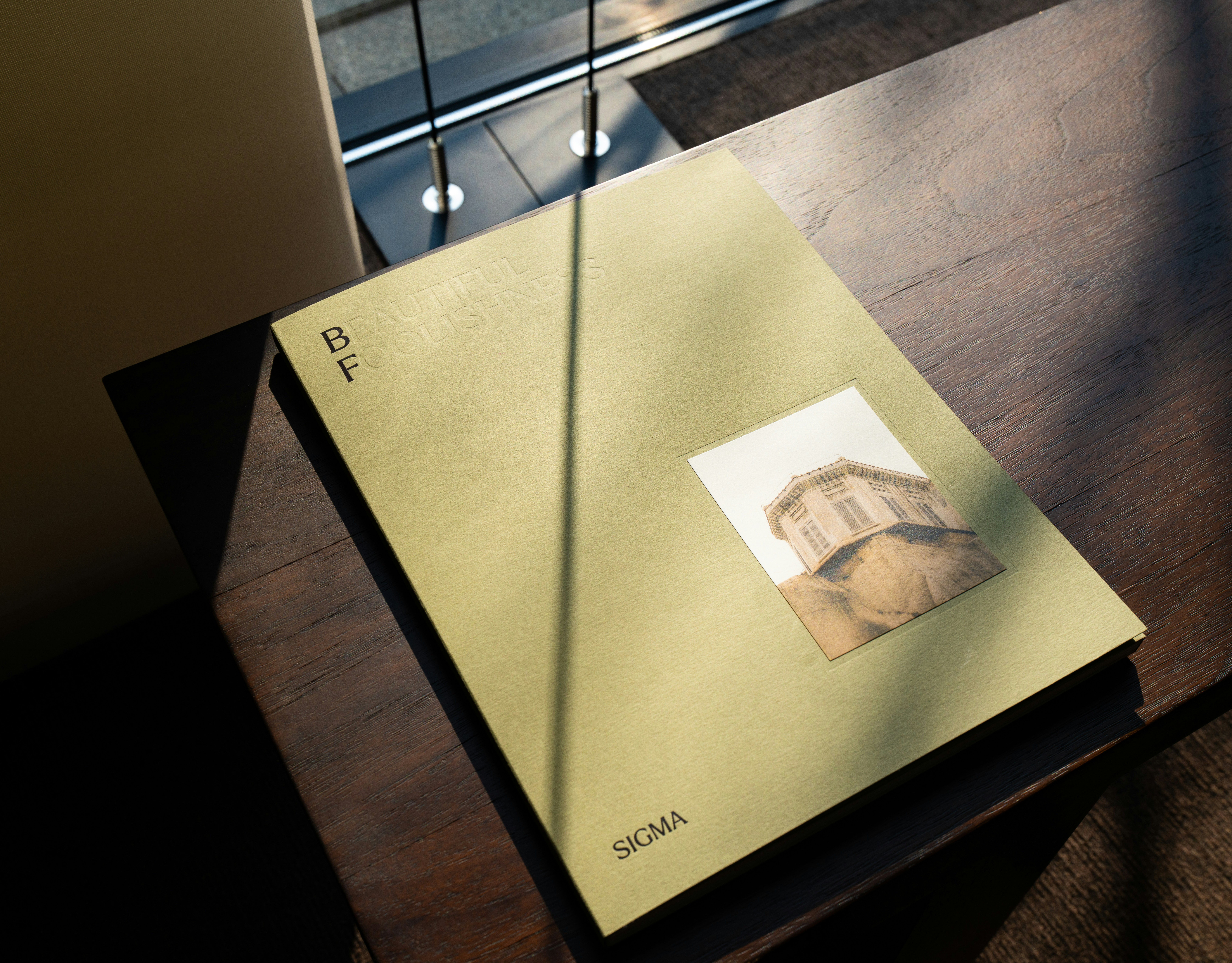 A closed book with a small picture on its cover.
