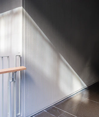 Modern interior with ribbed wall and sunlight