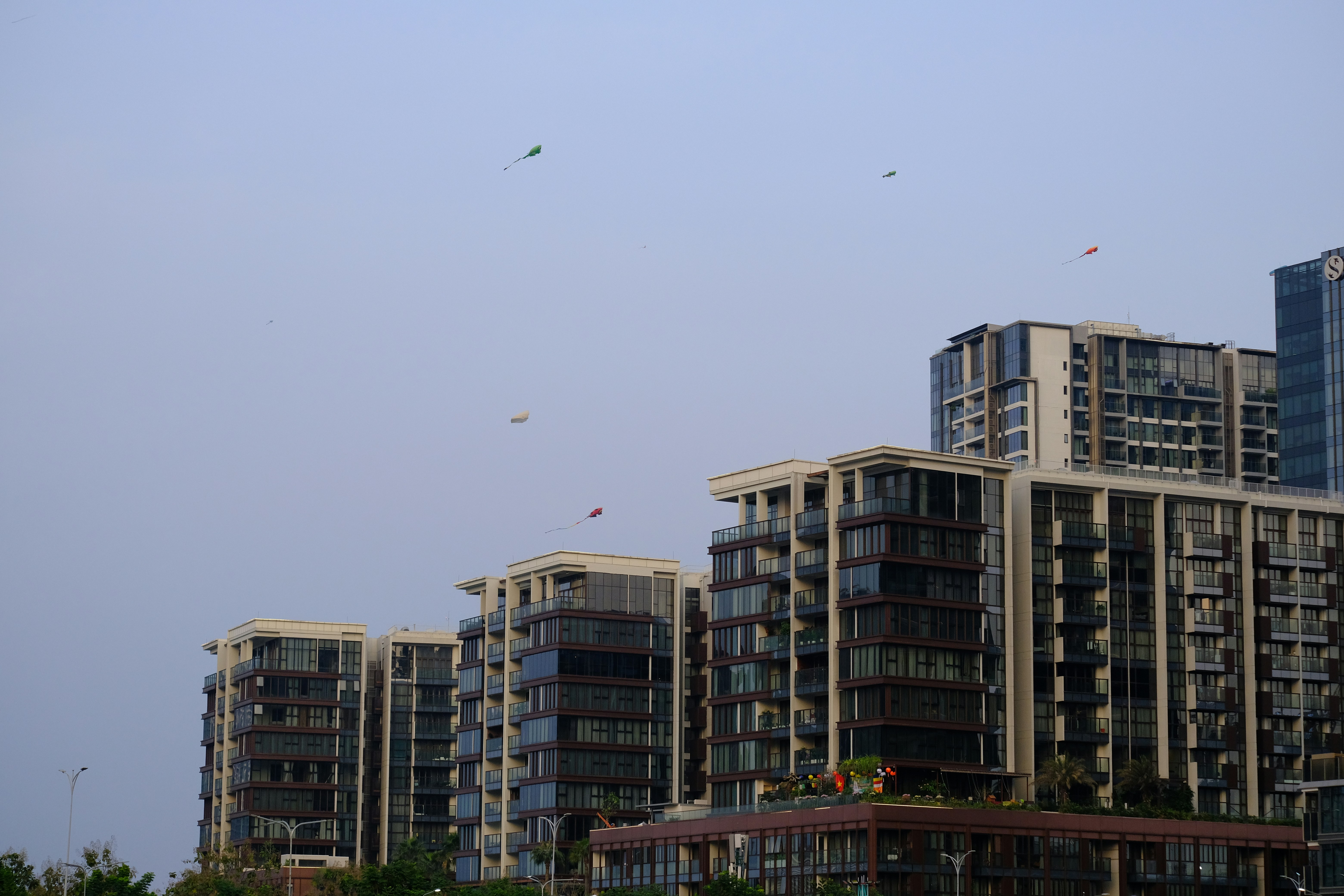 Modern apartment buildings against a pale sky