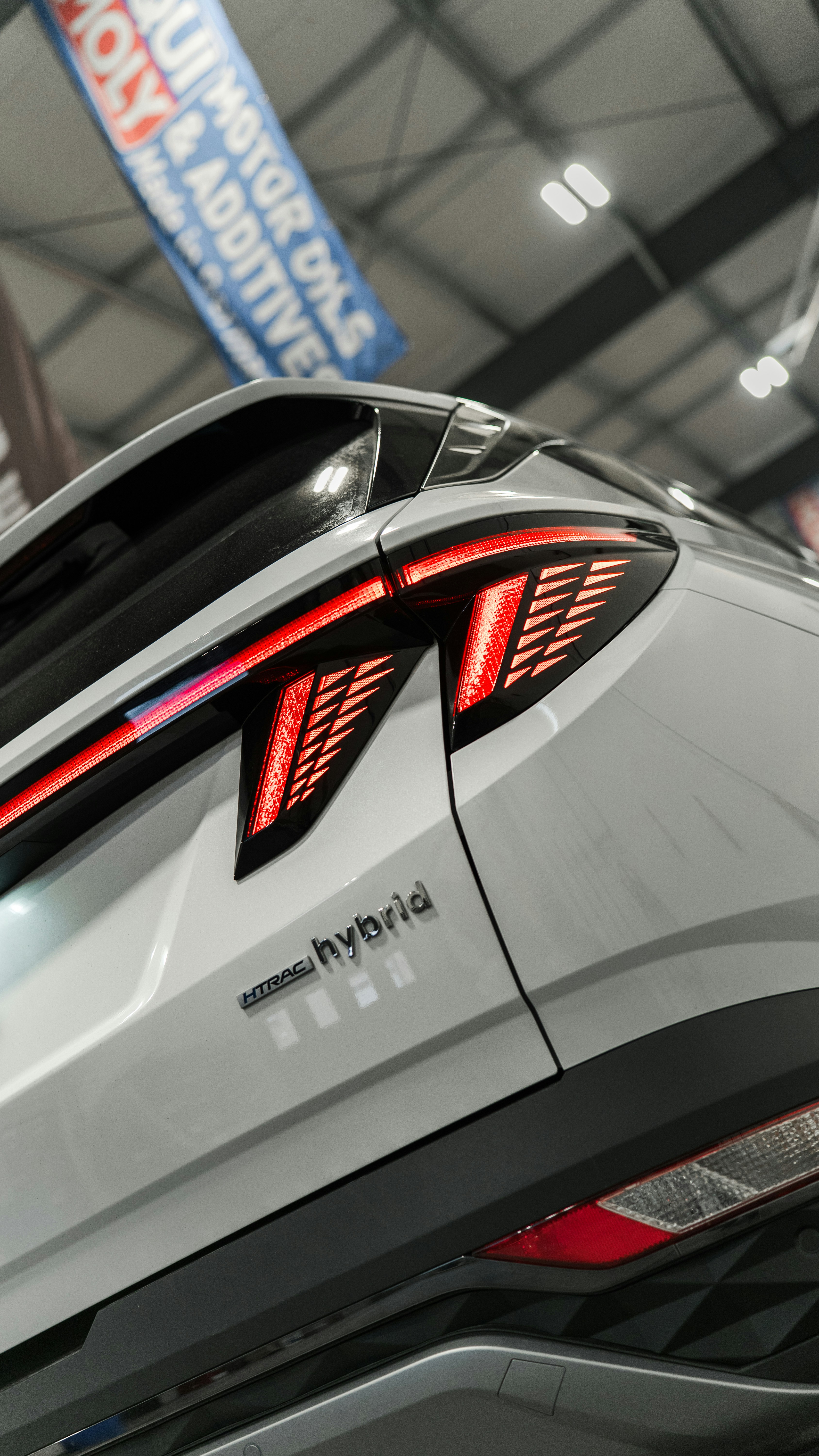 Modern car taillight with hybrid badging