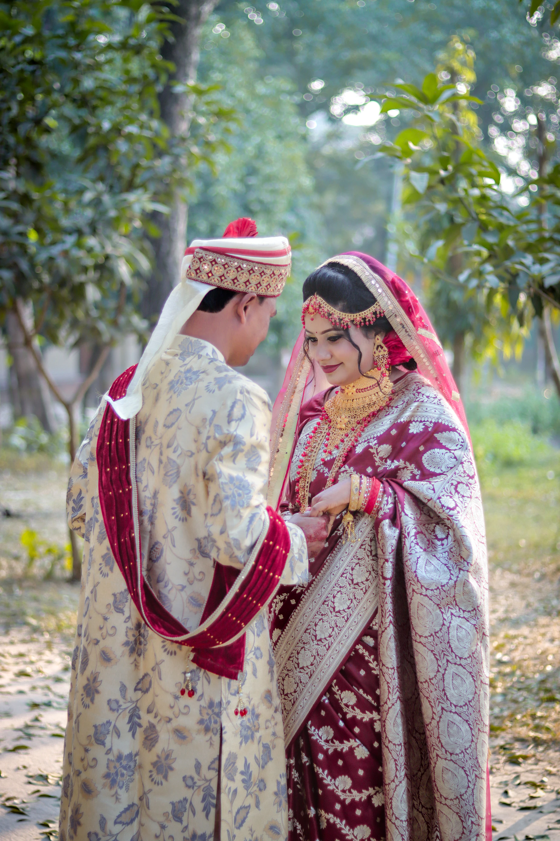 A newlywed couple in traditional indian wedding attire.