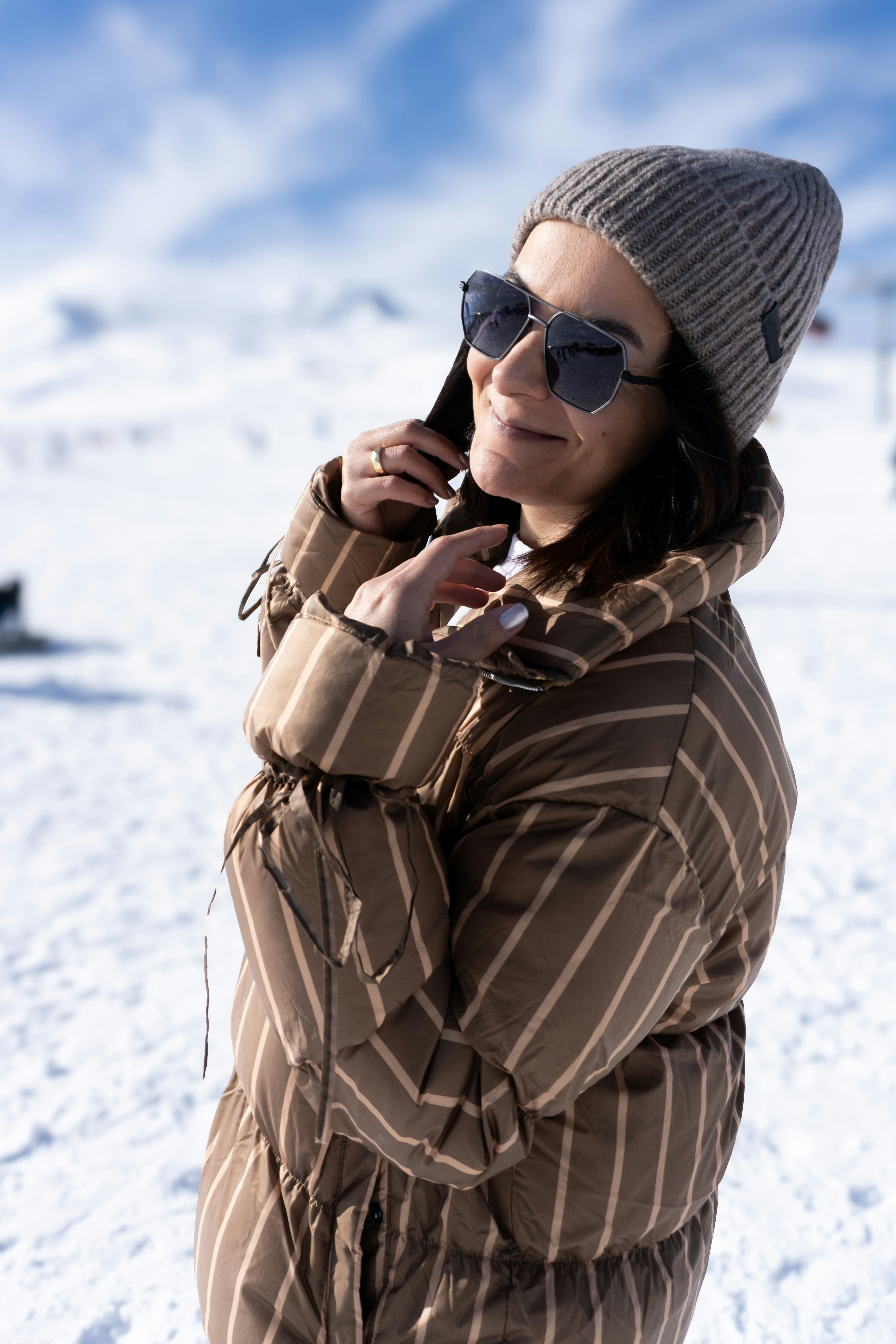Woman in winter clothing on a snowy mountain