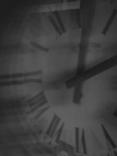 Close-up of a clock face with roman numerals