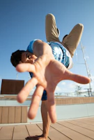 Man in mid-air, reaching out towards camera