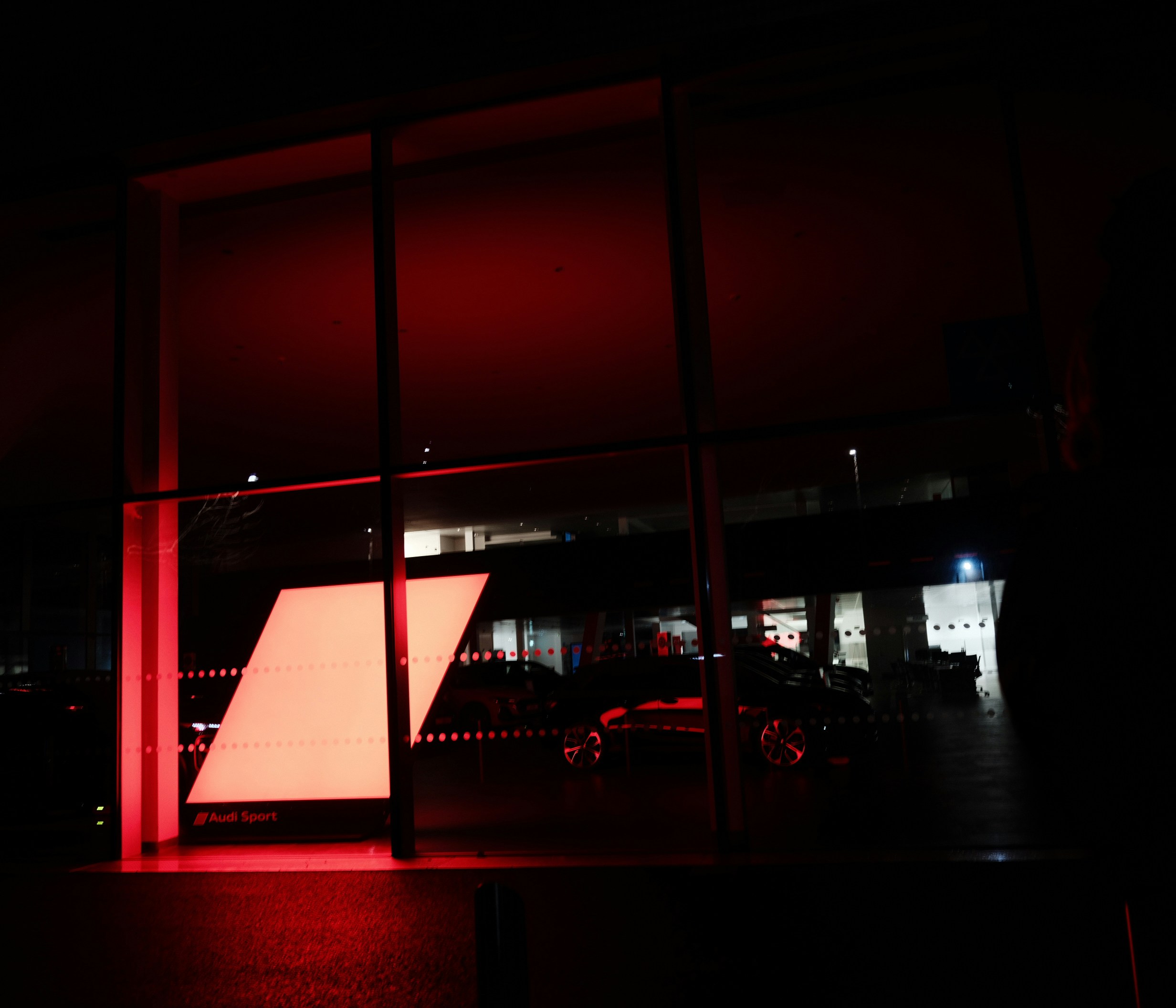 Modern building interior illuminated by red light