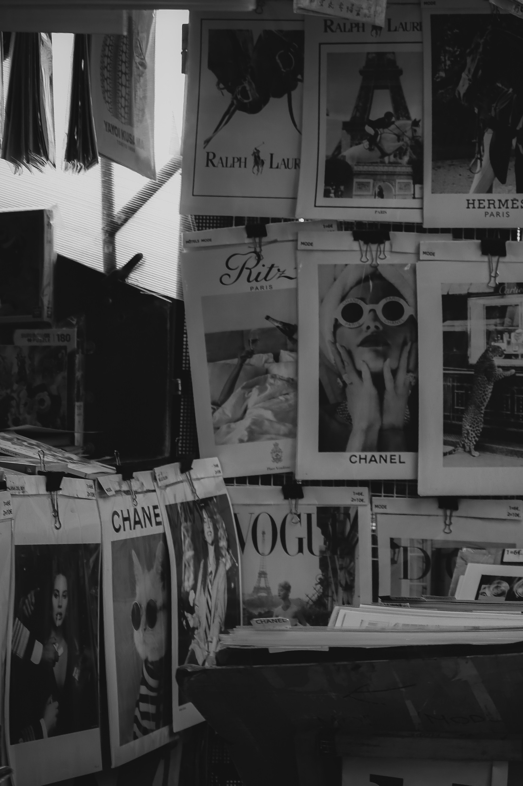 A hand-bound photography zine, open across a linen surface