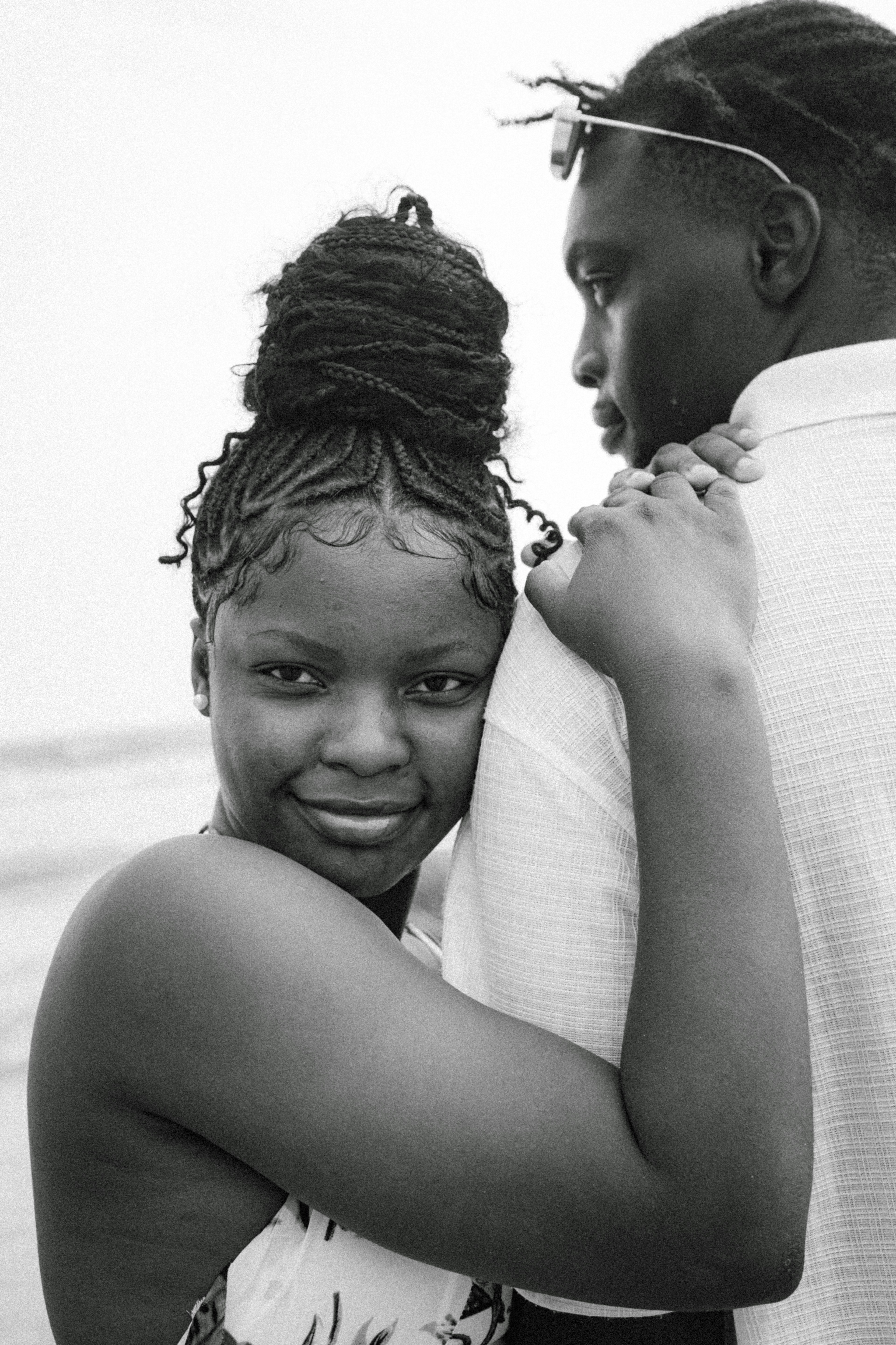 A young couple embracing on a beach
