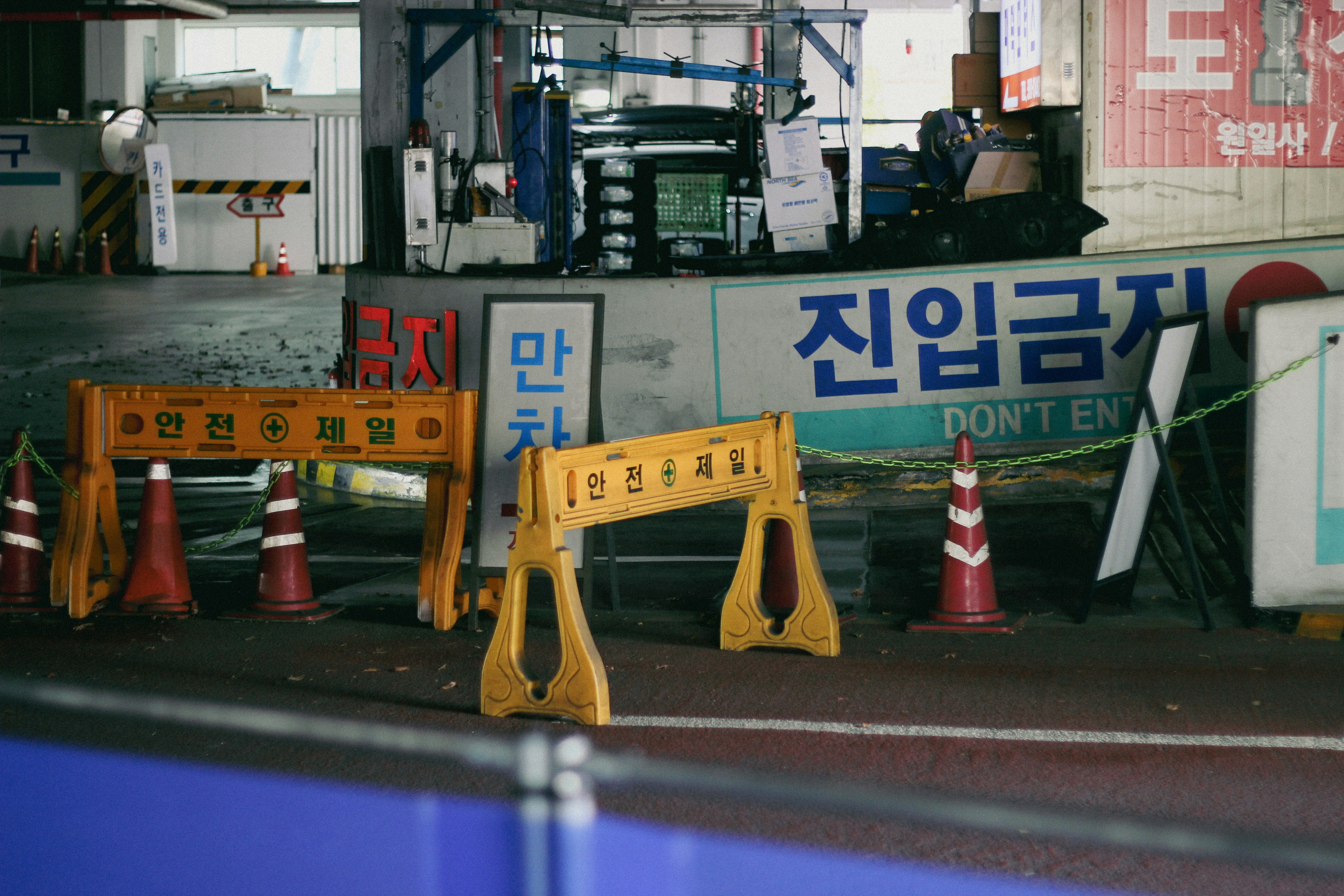 Koricar experts conducting quality inspection on used Korean export vehicles.